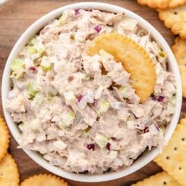 overhead shot of Tuna Salad in a bowl with a cracker