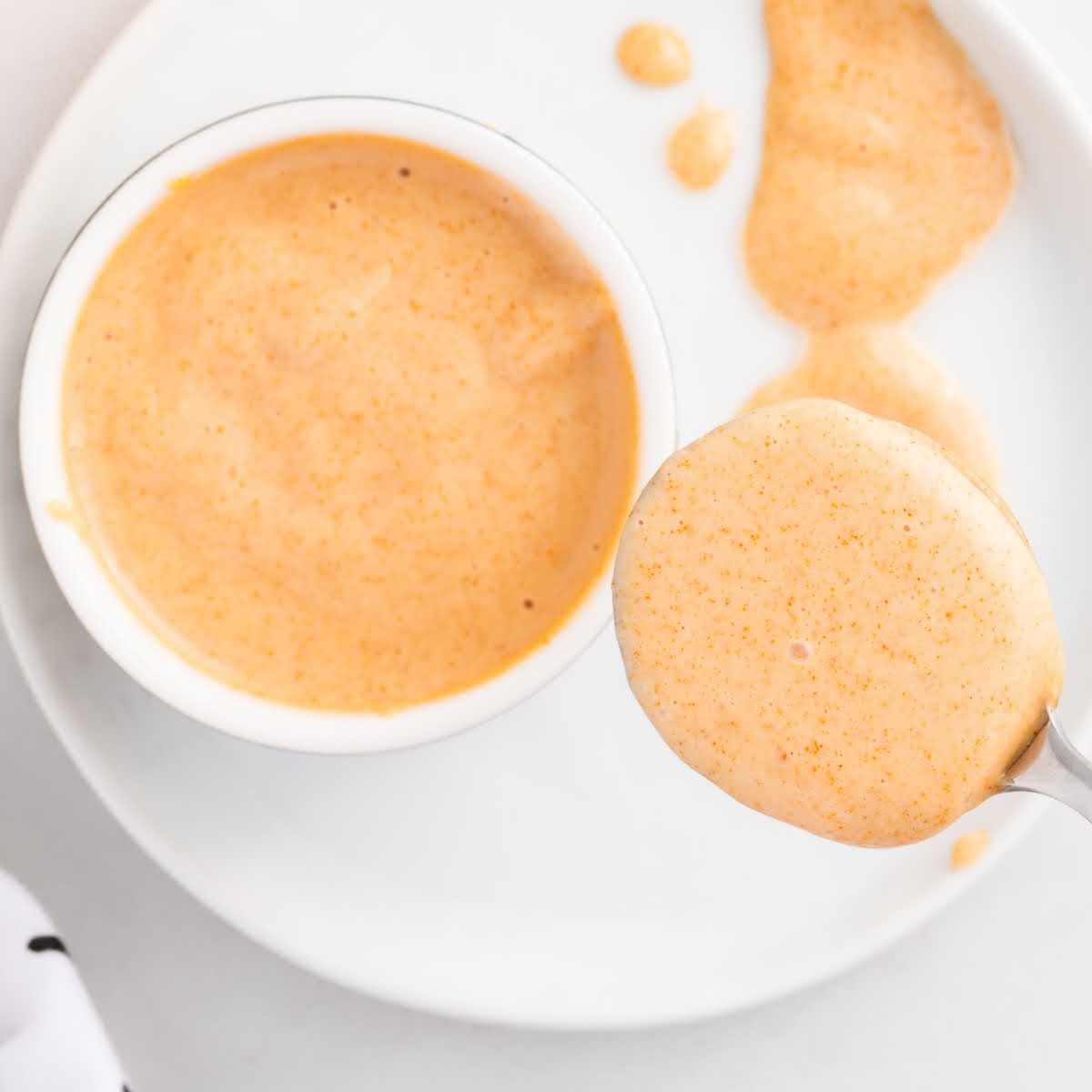 overhead shot of Yum Yum Sauce in a cup and on a spoon