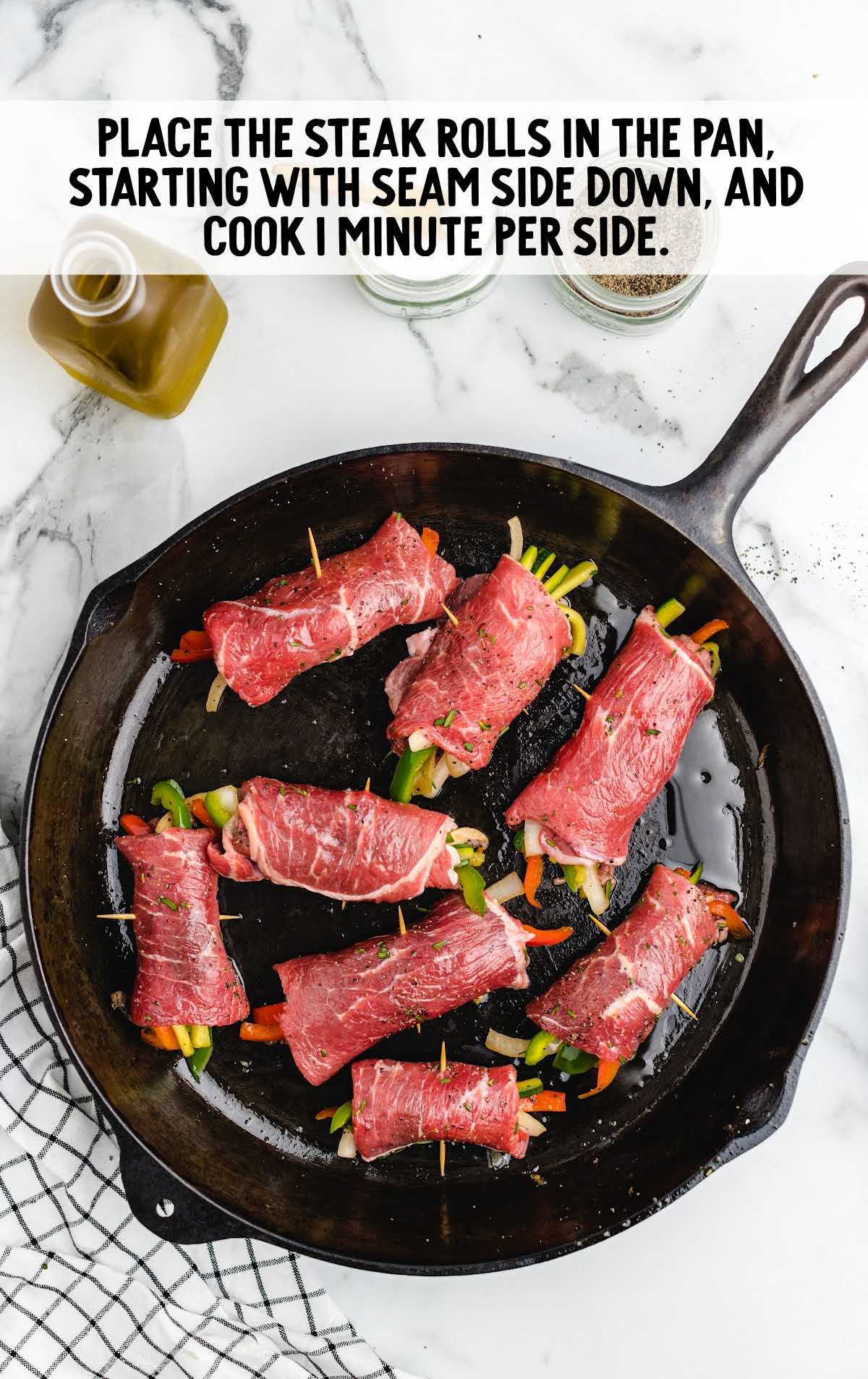 steak rolls placed in a pan