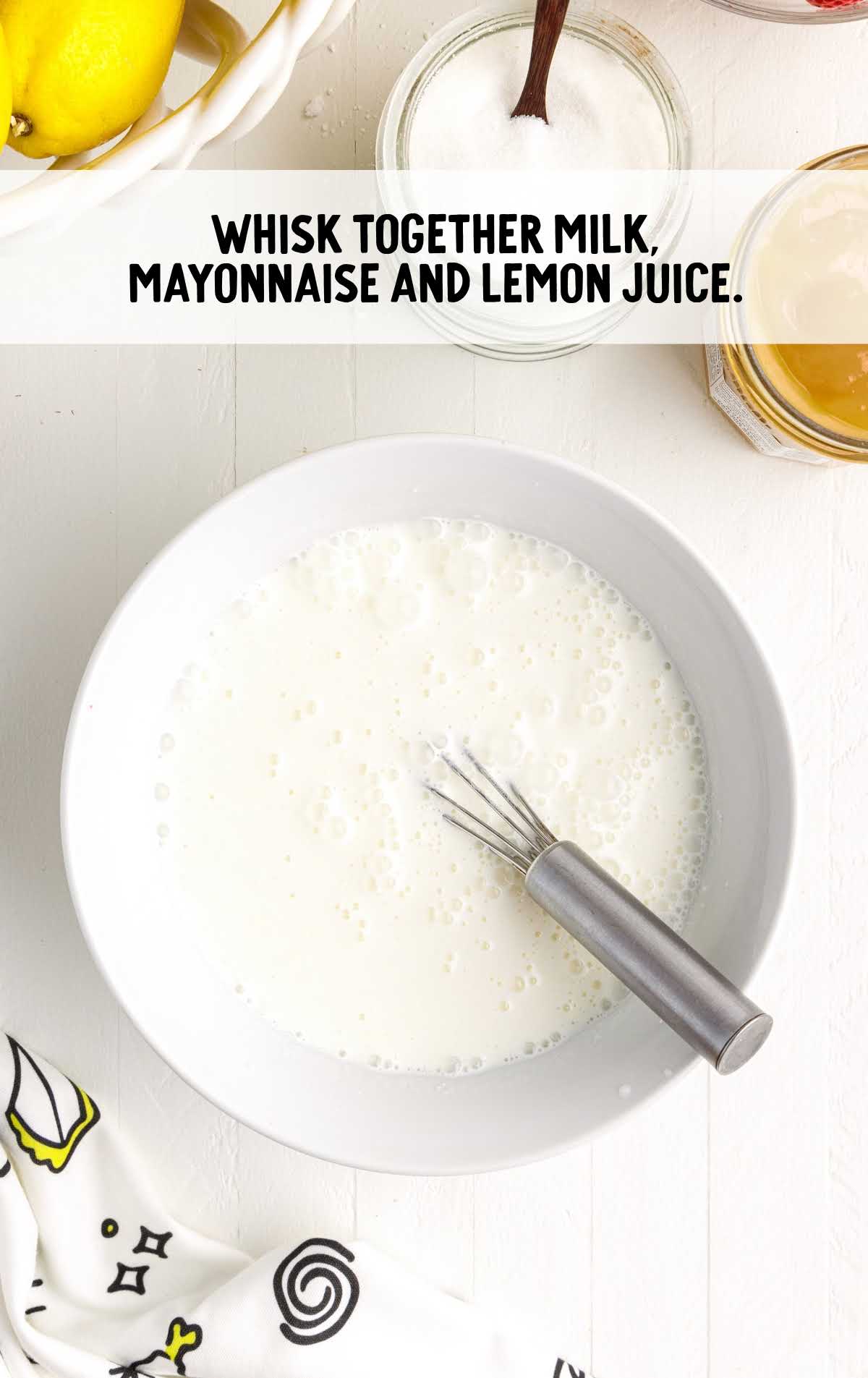 milk, mayonnaise and lemon juice whisked together in a bowl