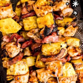 overhead shot of BBQ Chicken Kabobs with Bacon and Pineapple in a sheet pan