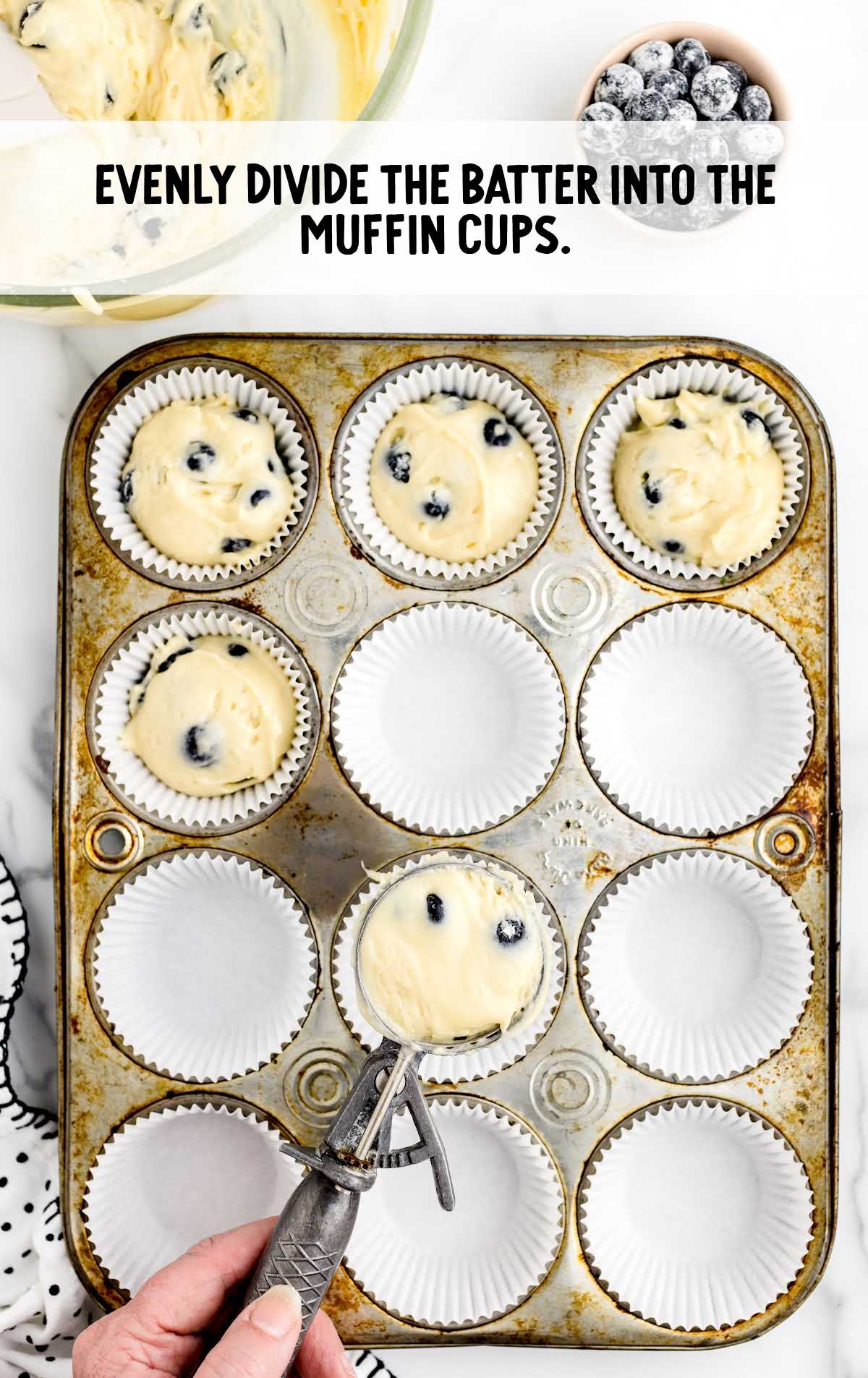 batter divided into the muffin cups in a cupcake tray