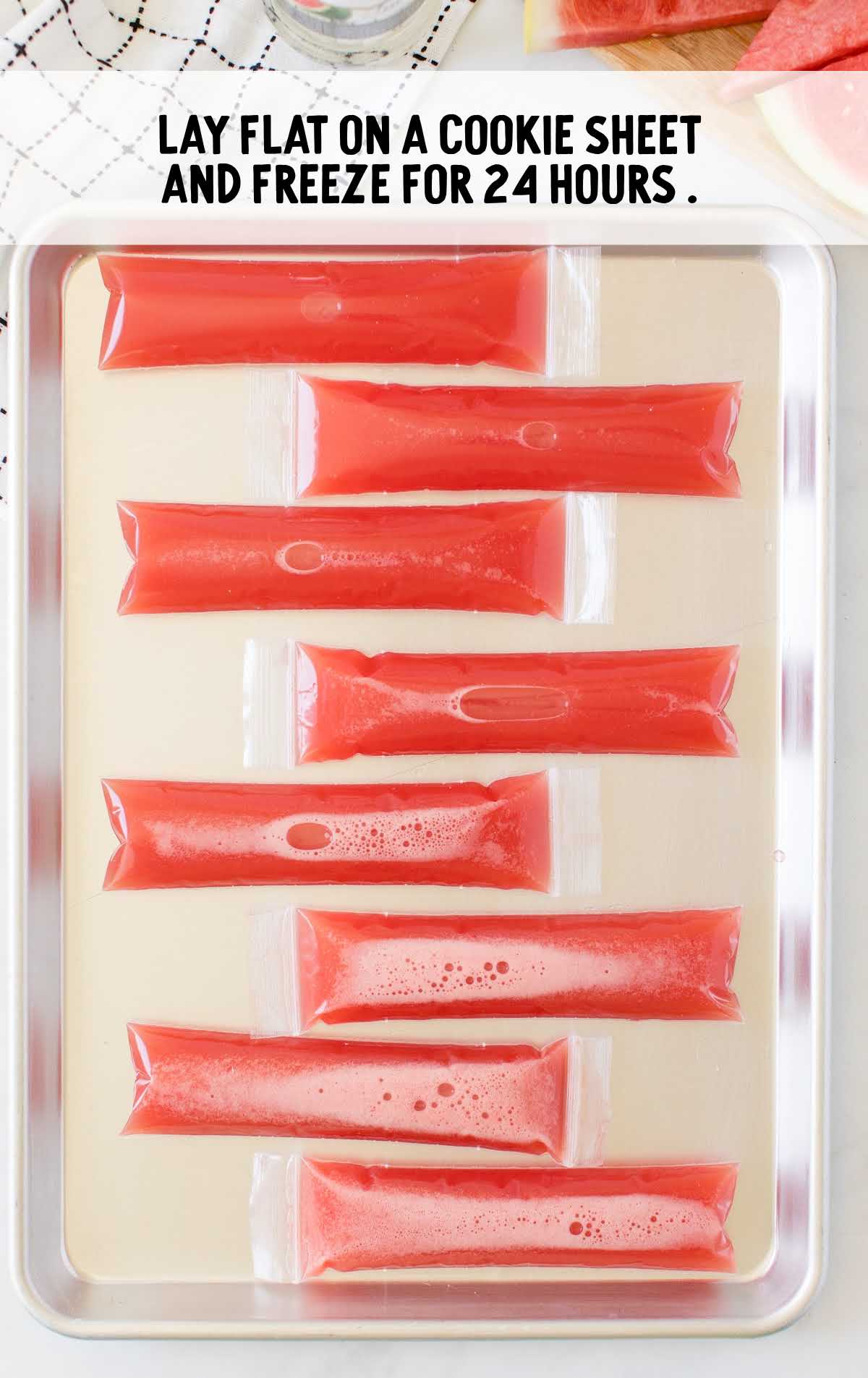 Boozy Popsicles placed in a cookie sheet