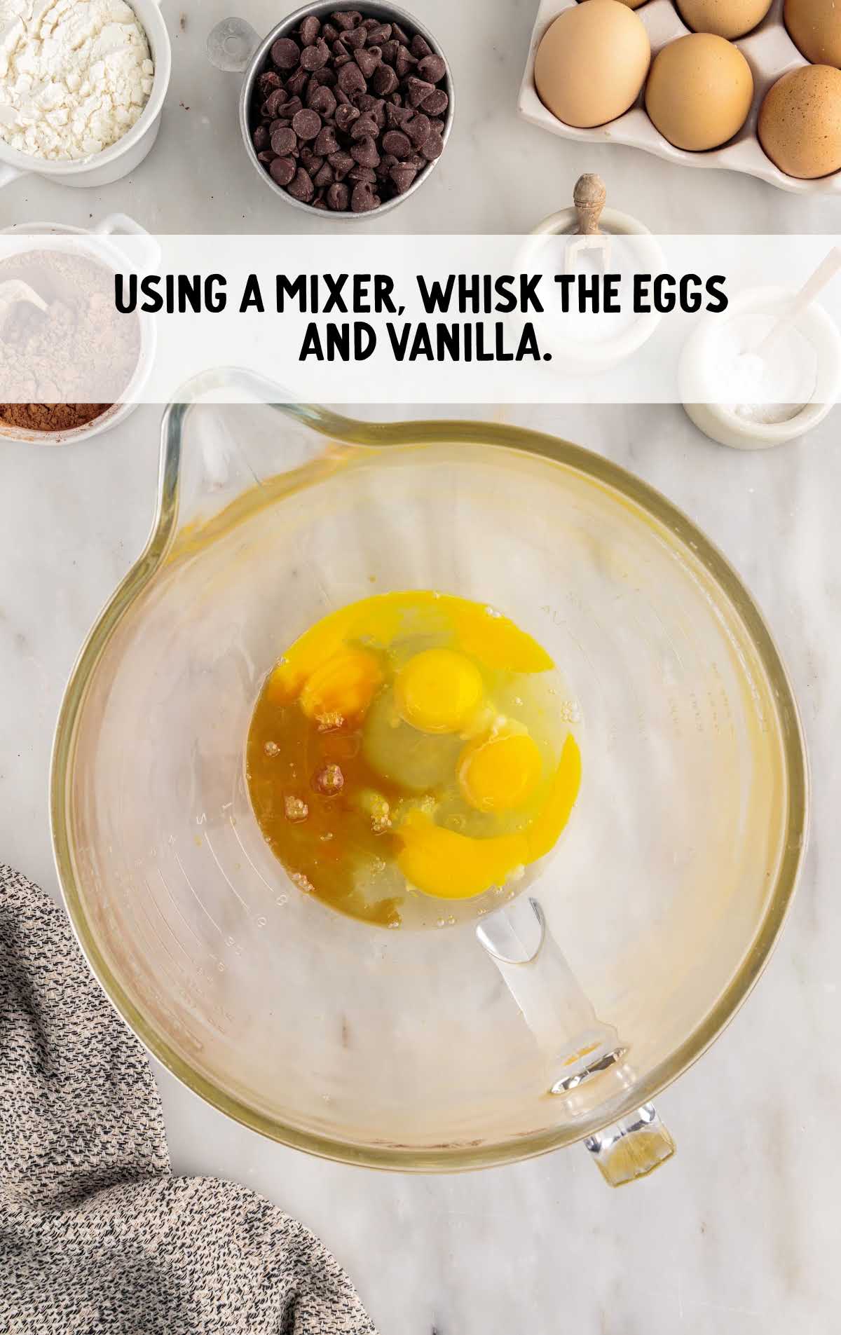 eggs and vanilla mixed in a cup