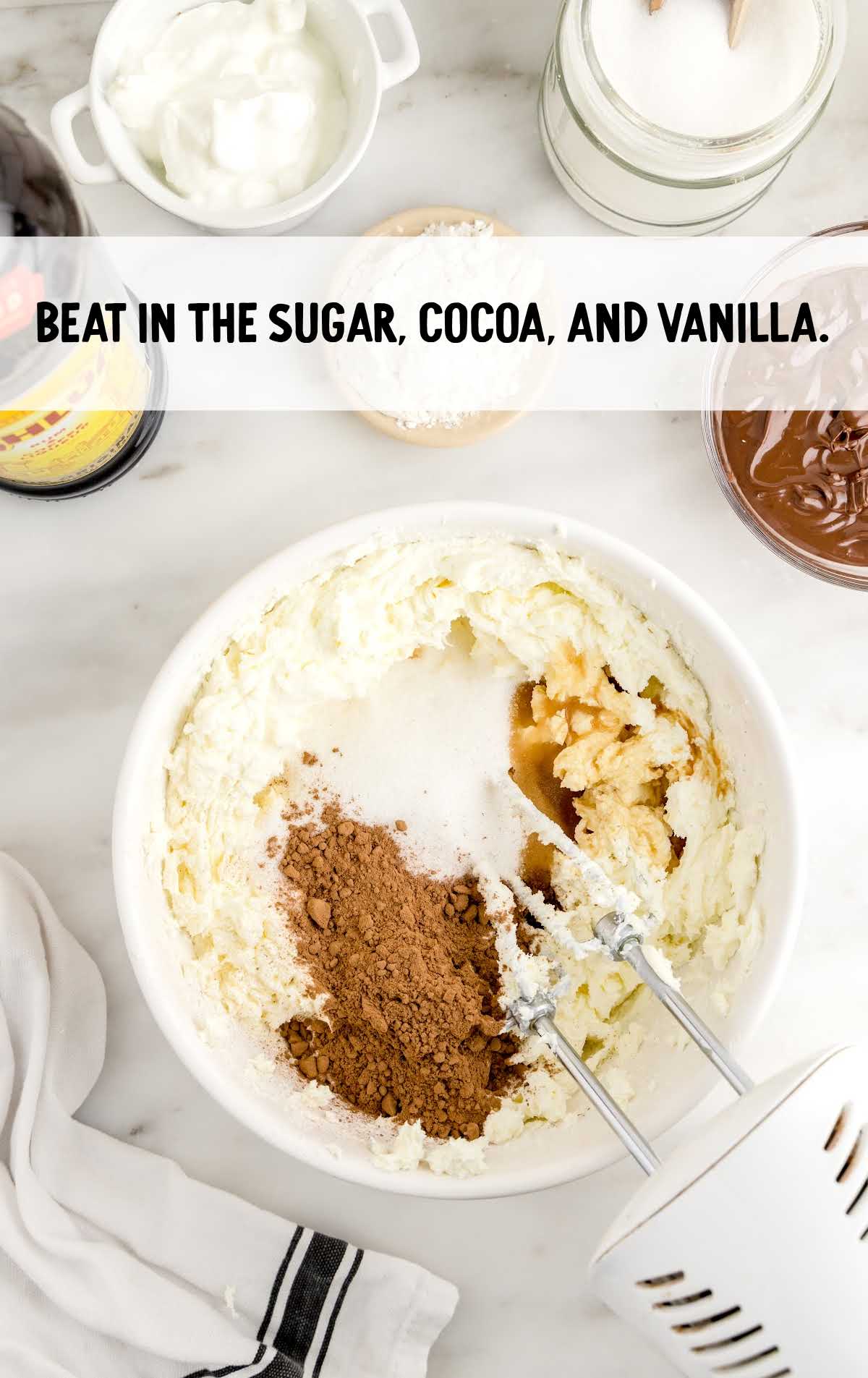 sugar, cocoa, and vanilla blended in a bowl