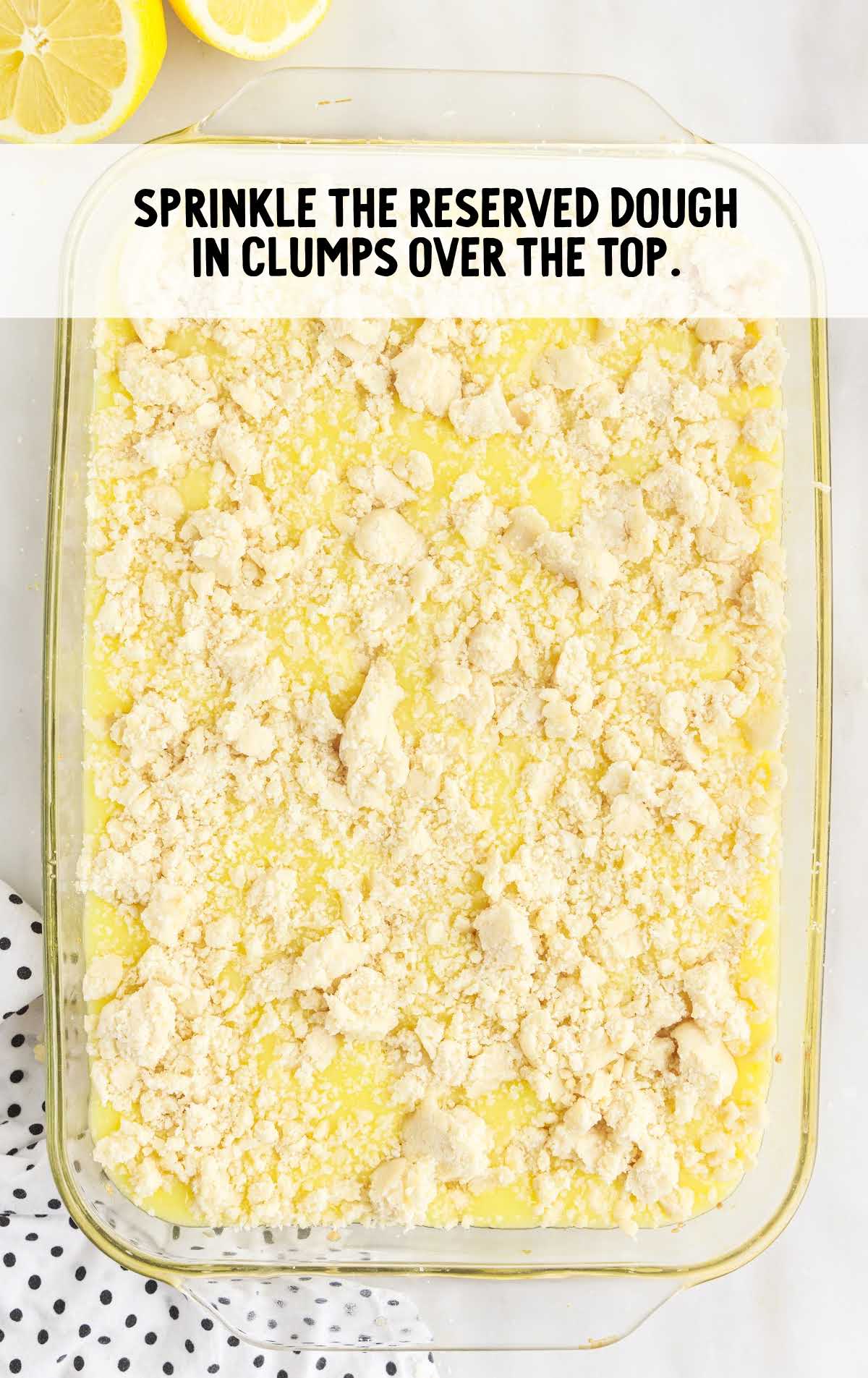 crumbs over the lemon pie filling in a baking dish
