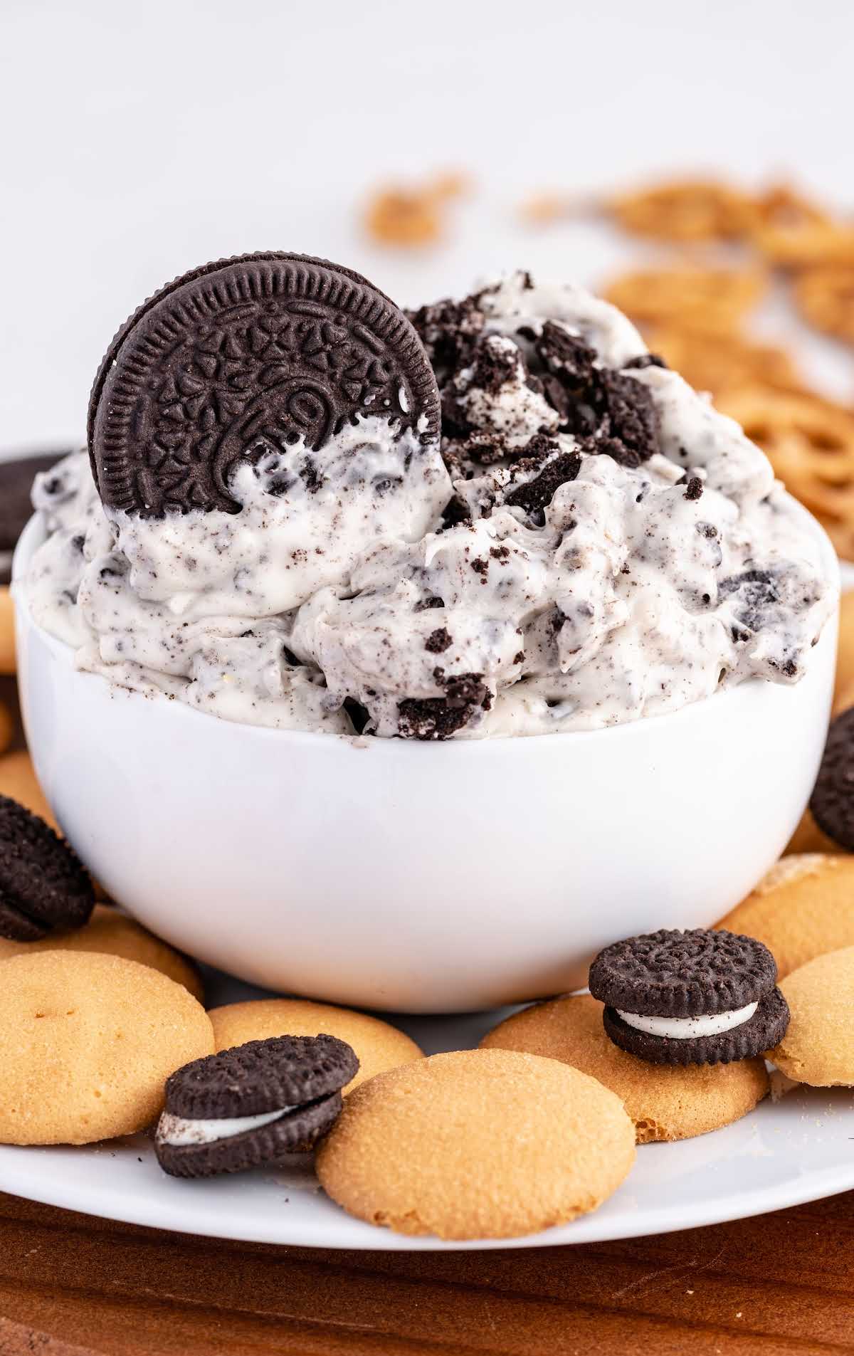 overhead shot of Oreo Dip in a bowl with wafers on a plate