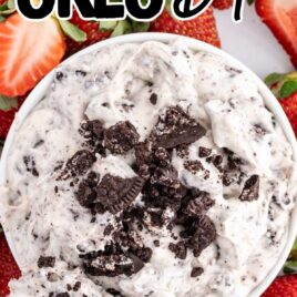 overhead shot of Oreo Dip in a bowl with strawberry slices on a plate
