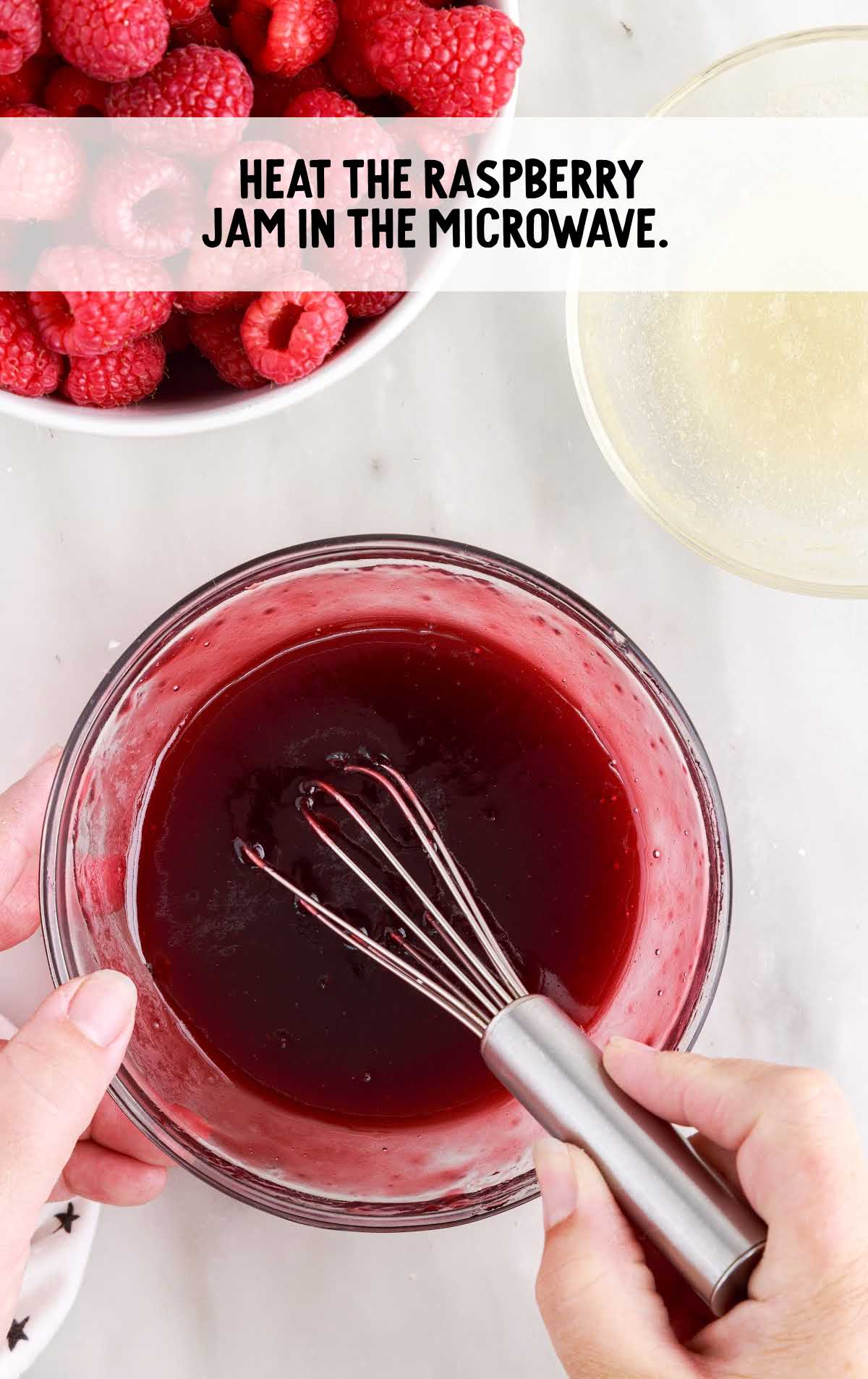 raspberry jam whisked in a bowl