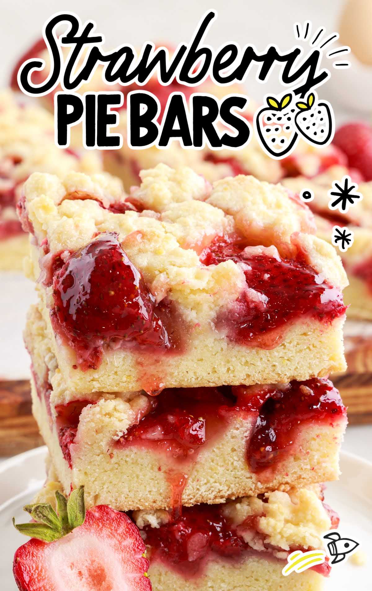 close up shot of slices of Strawberry Pie Bars stacked on top of each other