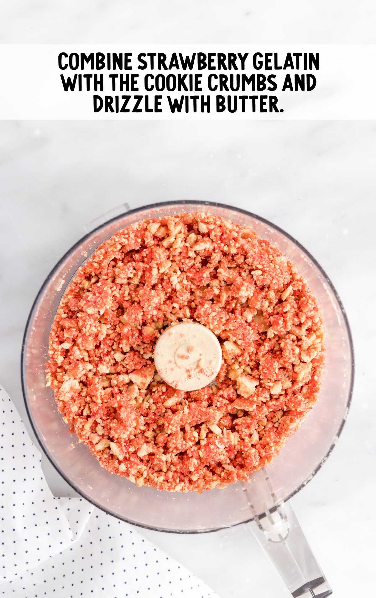 strawberry gelatin combined with cookie crumbs and drizzled with butter in a bowl