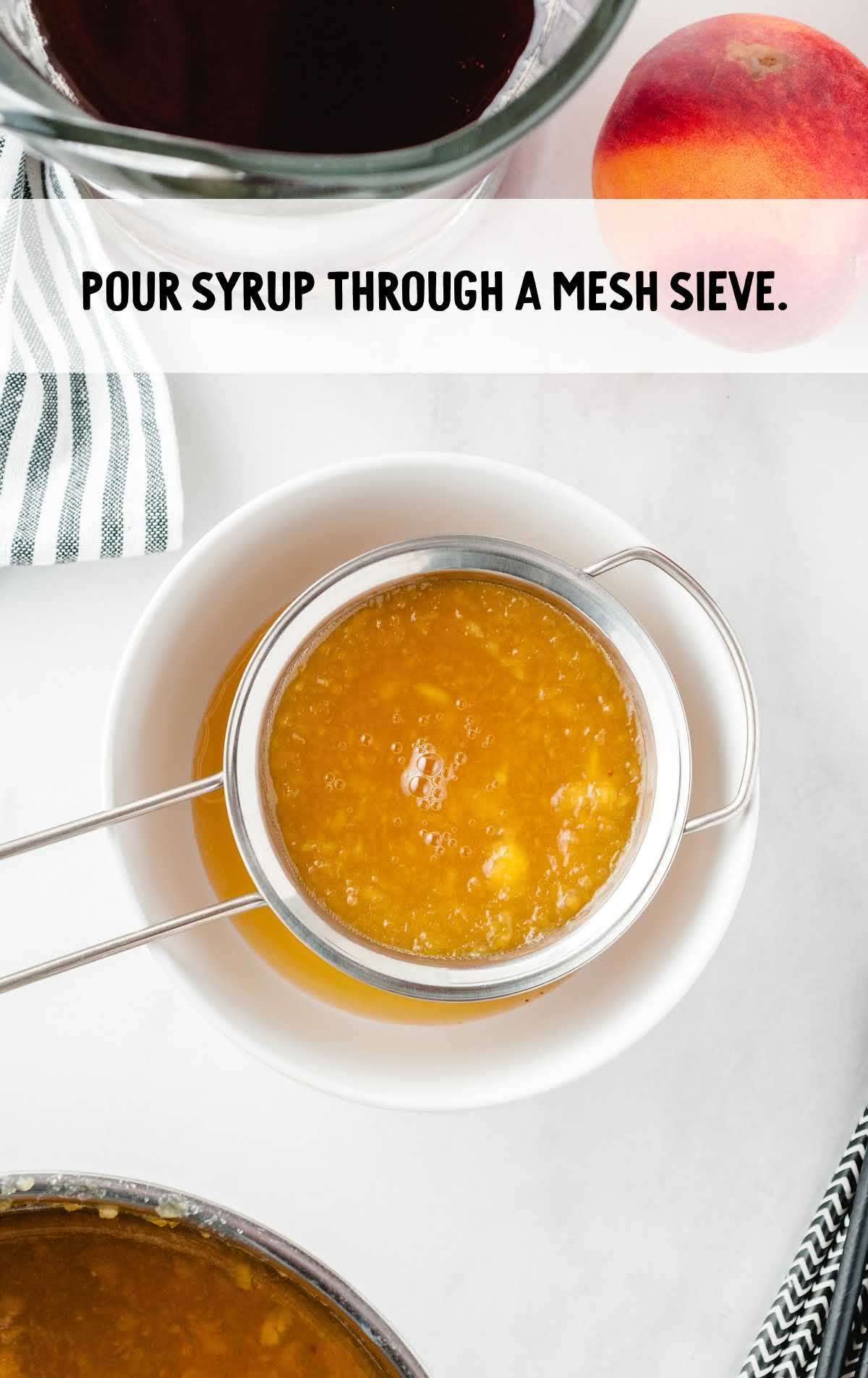 syrup added to the pureed peaches through a mesh sieve