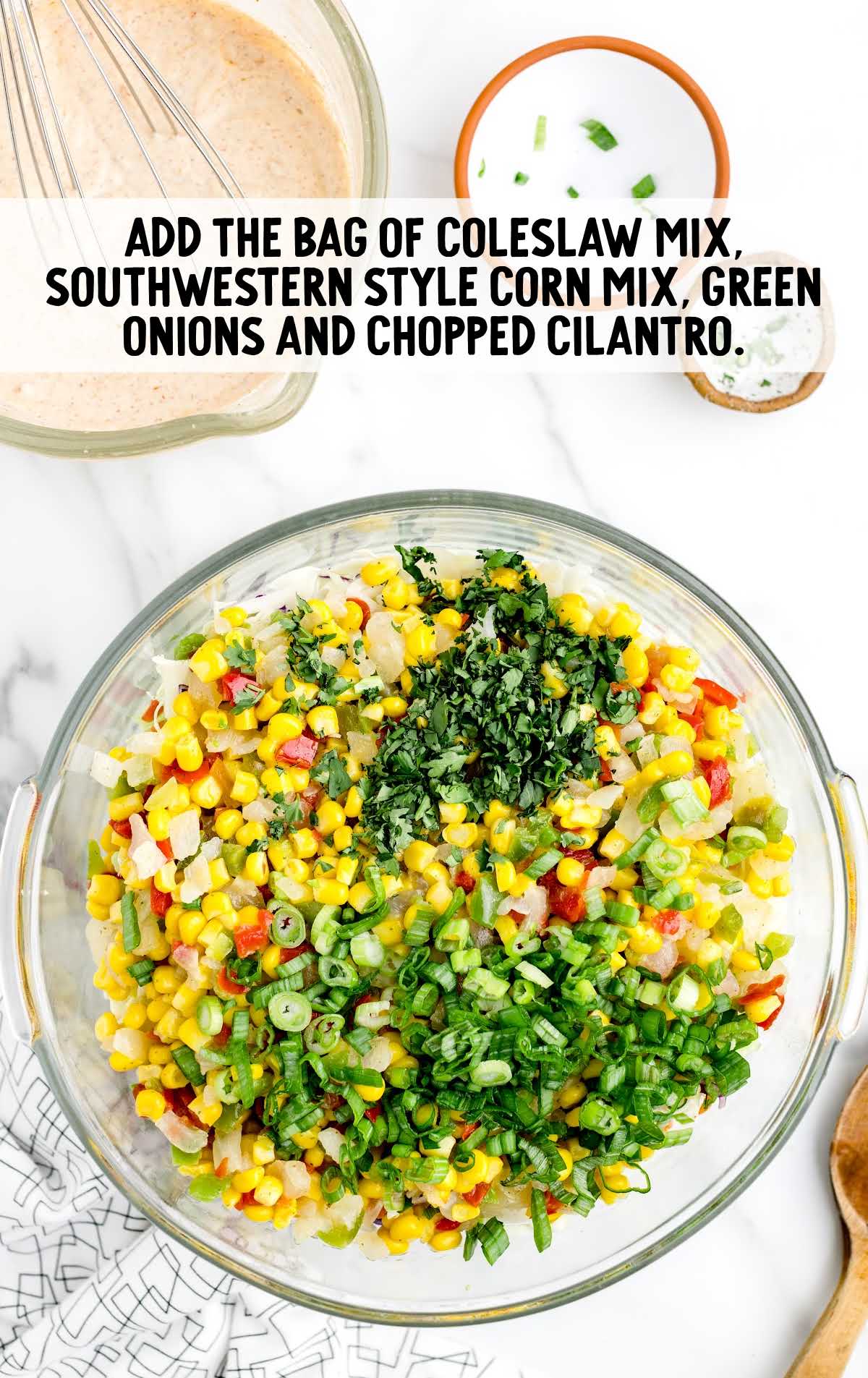 coleslaw mix, southwestern corn mix, green onions and chopped cilantro combined in a bowl