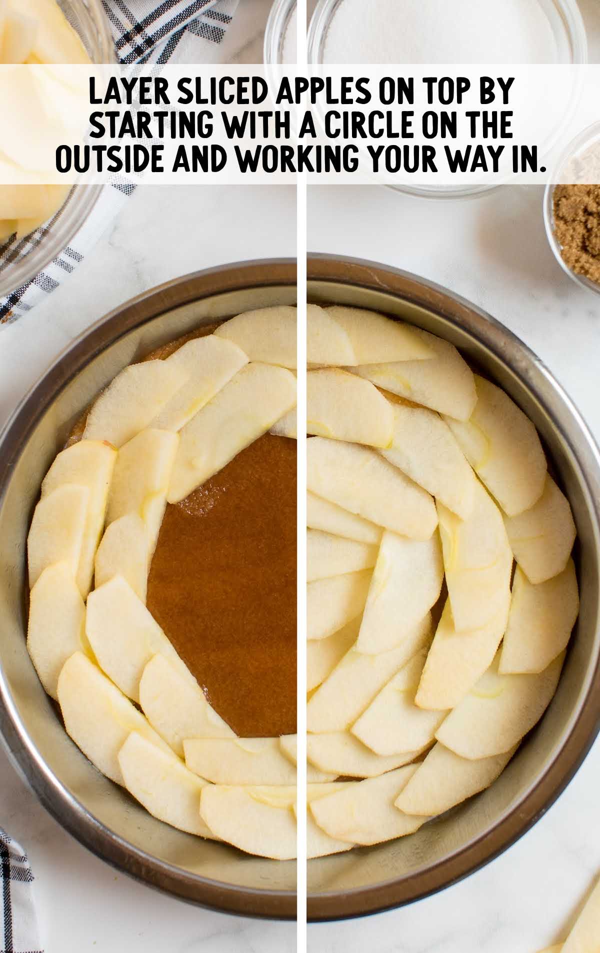 sliced apples laid on top of sugar mixture in a cake pan
