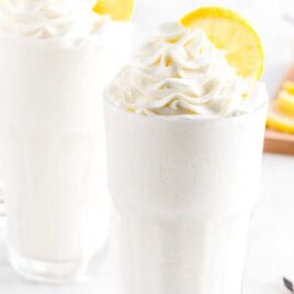 close up shot of tall glass topped with Whipped Lemonade