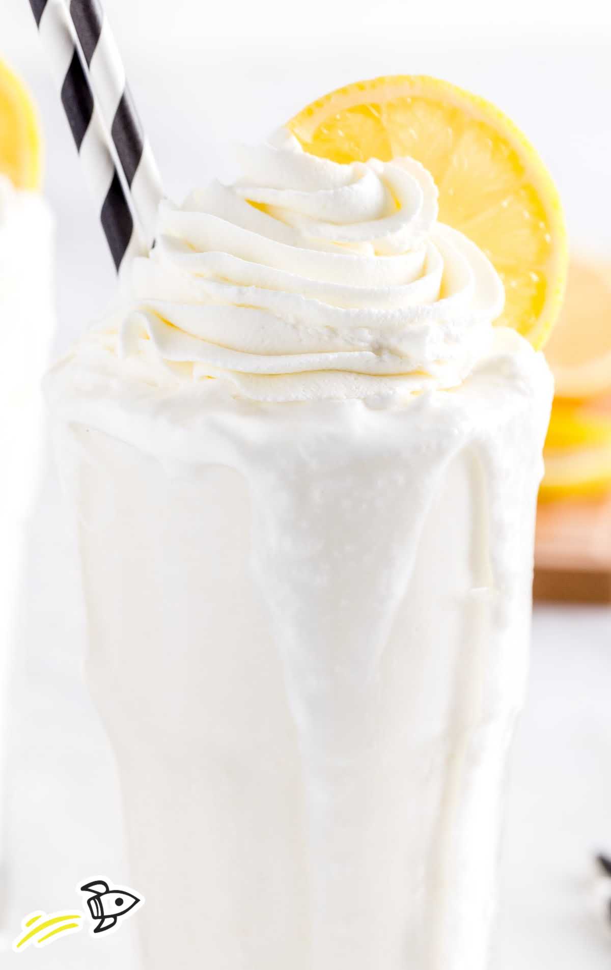 close up shot of tall glass topped with Whipped Lemonade