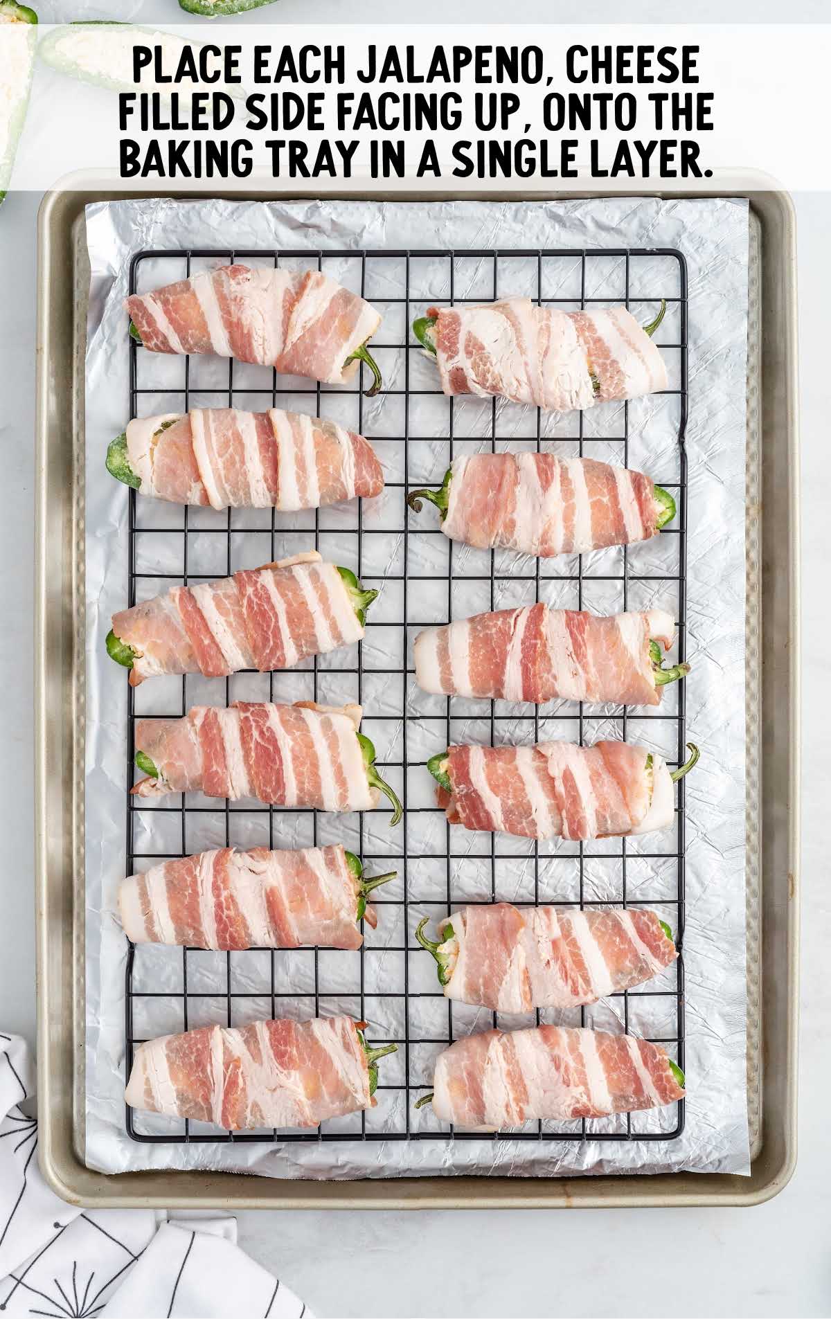Bacon-Wrapped Jalapeño Poppers on a baking tray