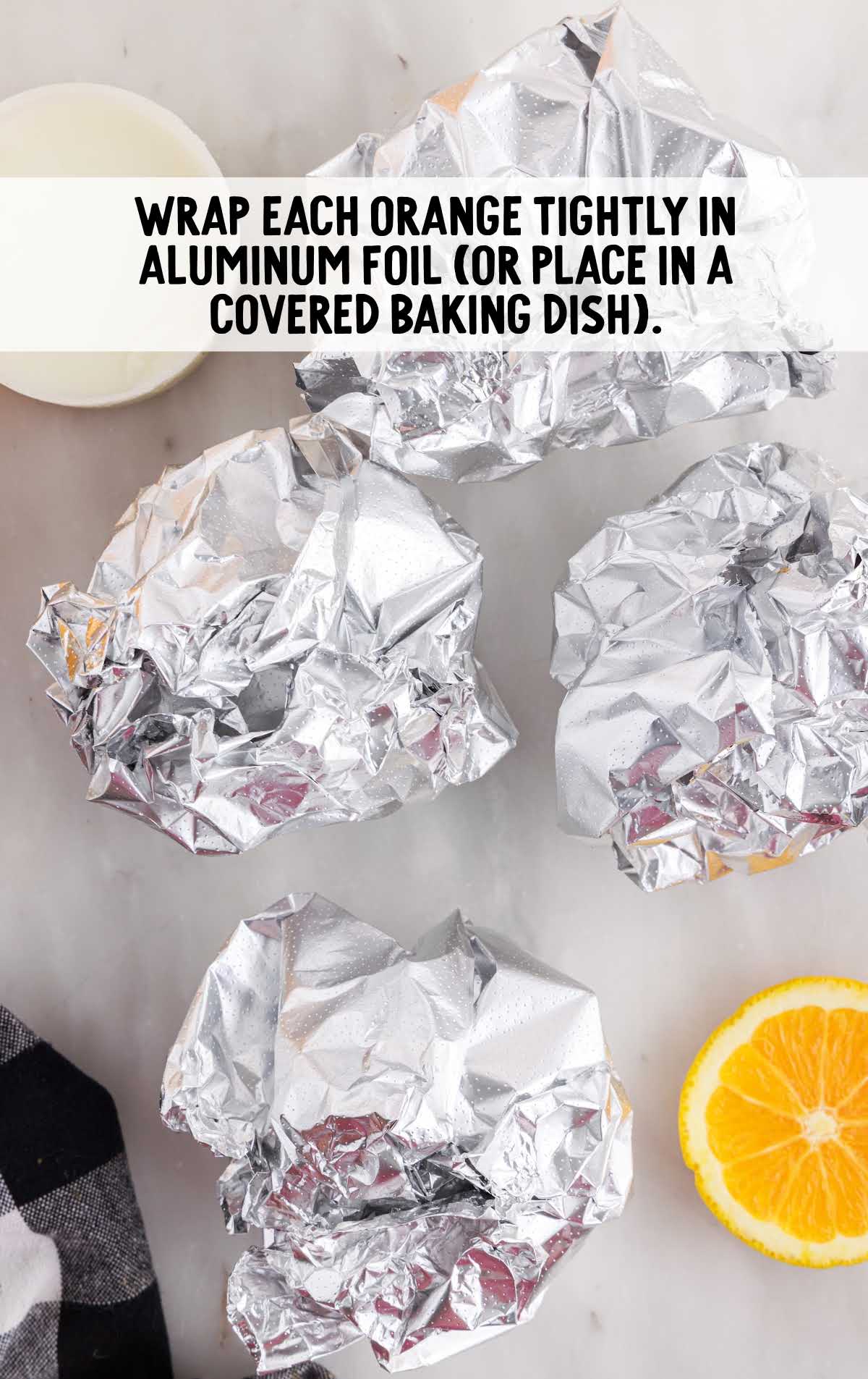 oranges wrapped tightly with aluminum foil