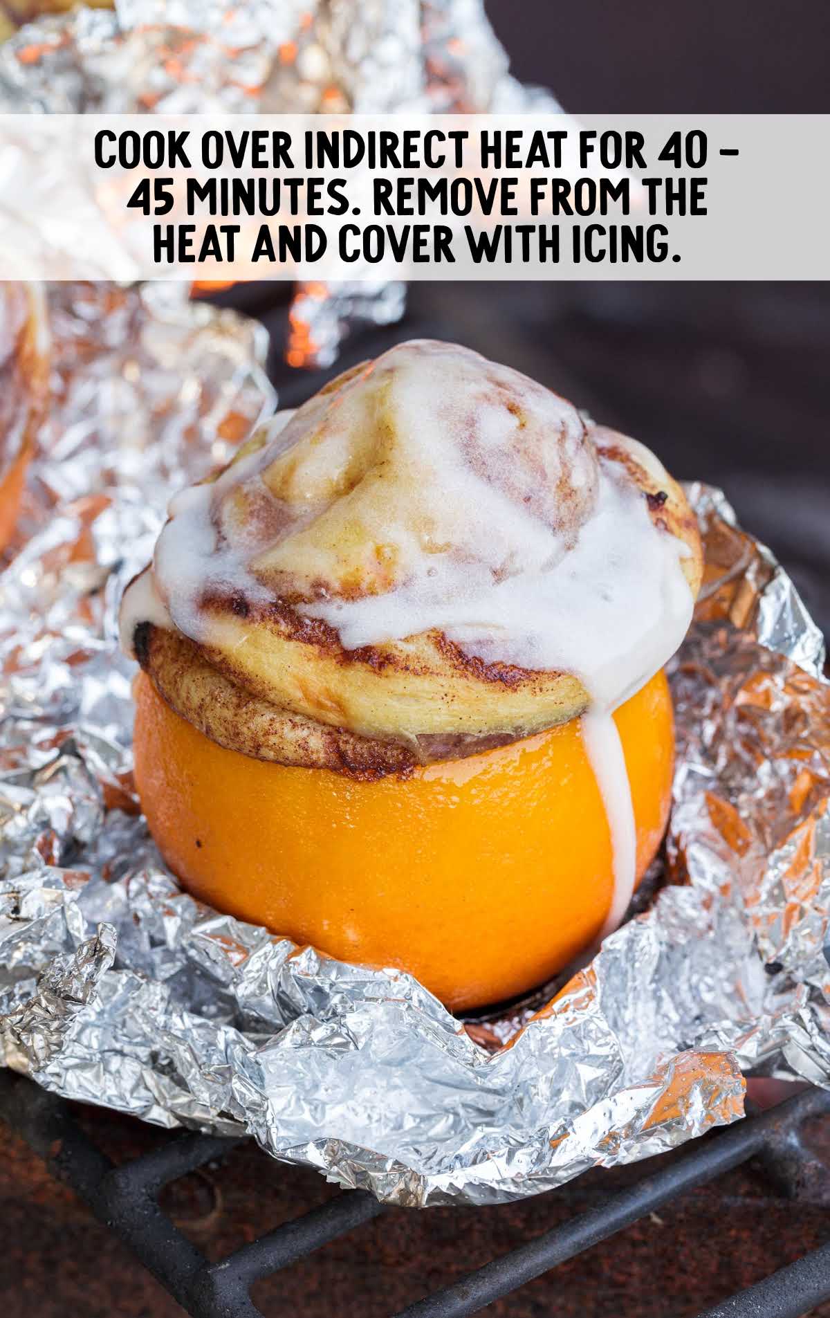 Campfire Oranges covered with icing on aluminum foil