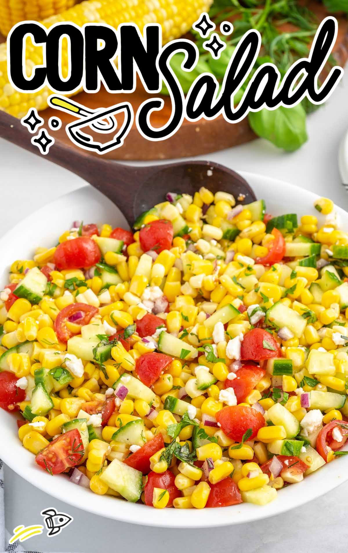 close up shot of Corn Salad in a bowl served with a wooden spoon