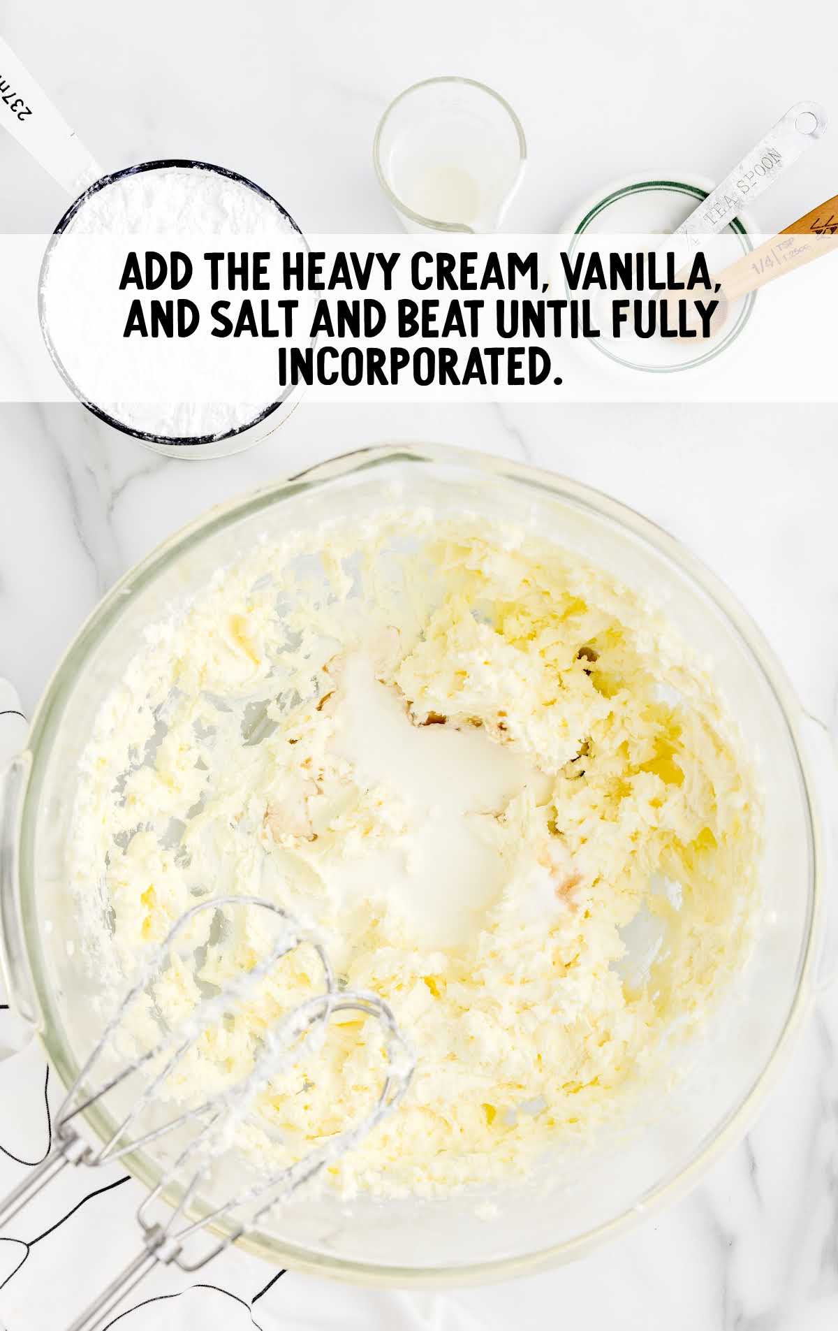 heavy cream, vanilla, and salt blended together in a bowl