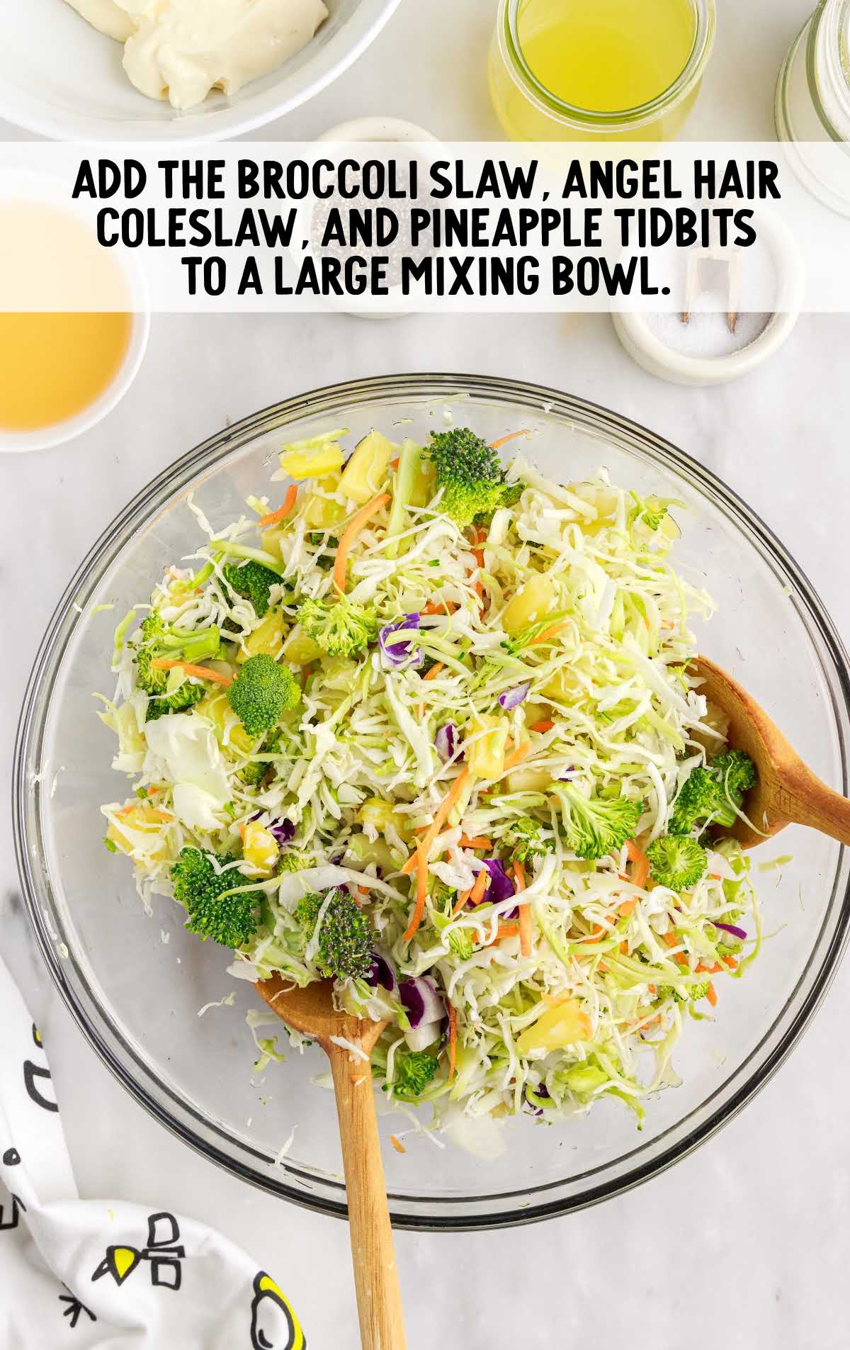 broccoli slaw, angel hair coleslaw, and pineapple tidbits combined in a bowl
