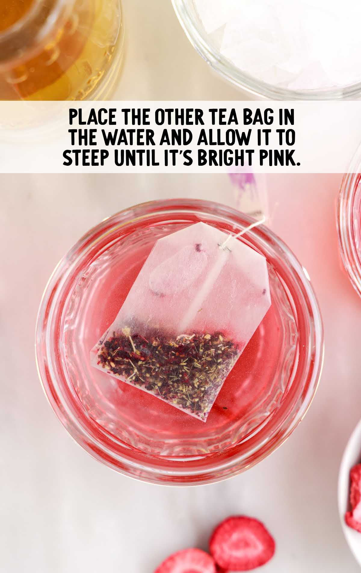 tea bag placed in a glass of water
