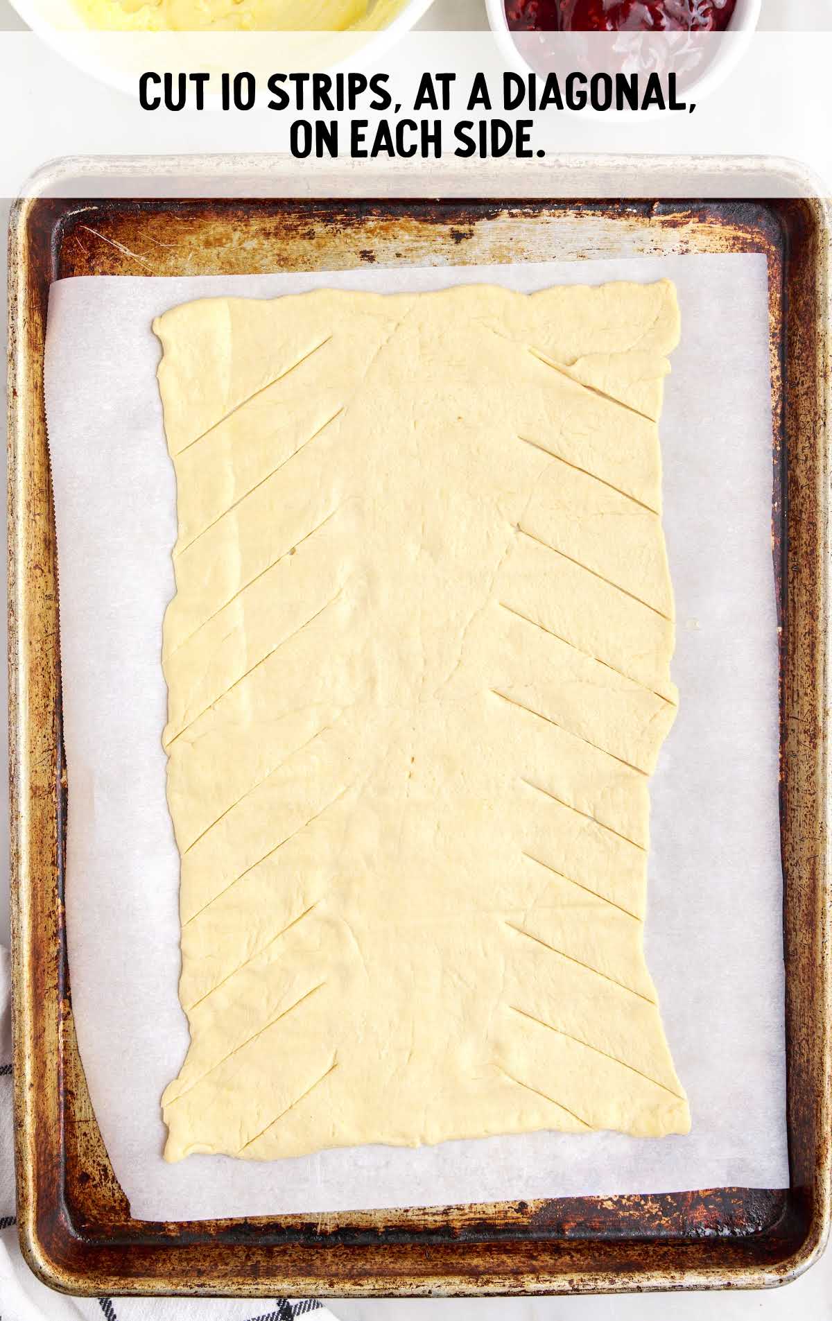 strips cut at a diagonal on each side in a baking dish