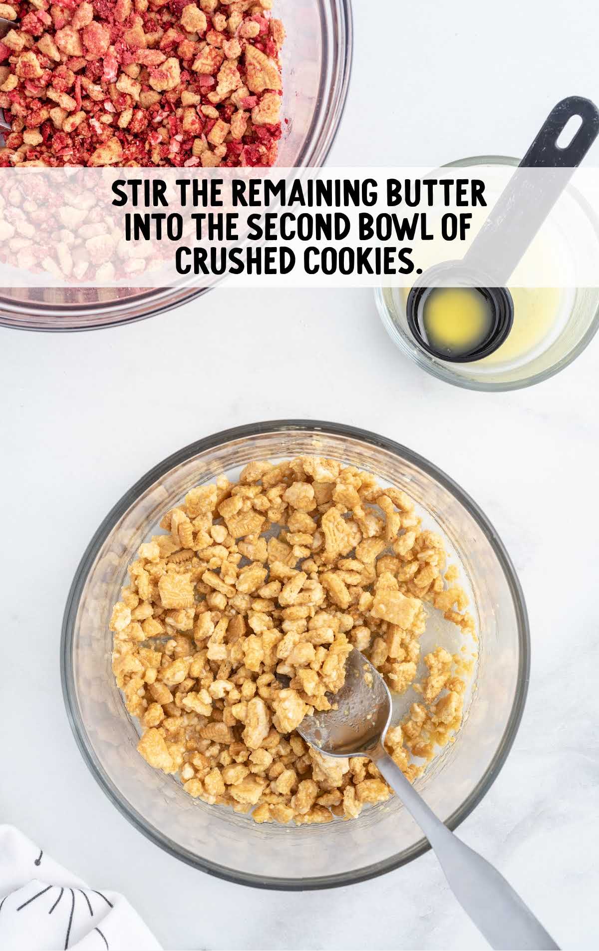 butter stirred together into the second bowl of crushed cookies in a bowl