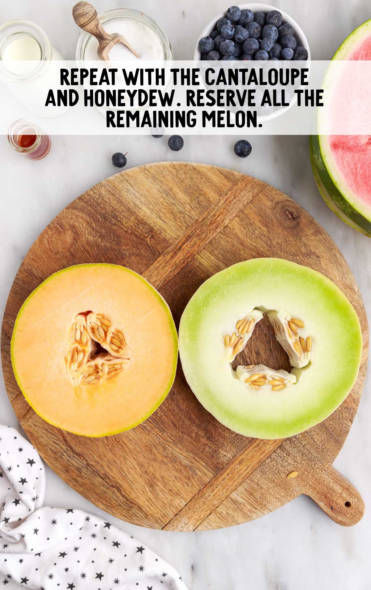 2 slabs of cantaloupe and honeydew on a cutting board
