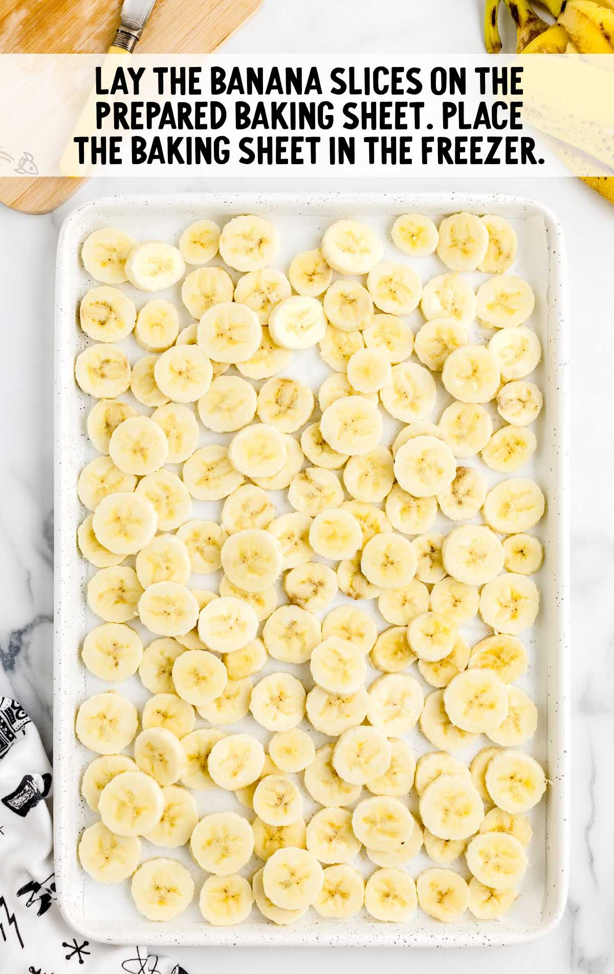 banana slices placed on a baking sheet 