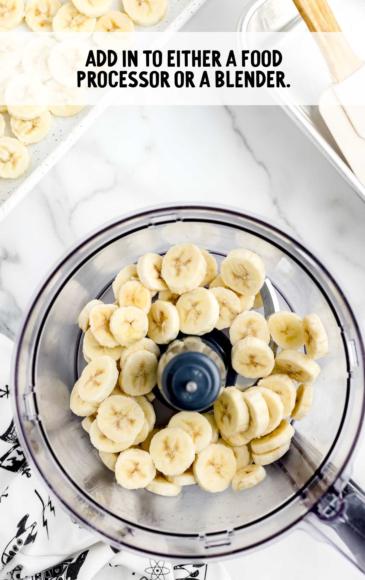 banana sliced placed in a food processor 