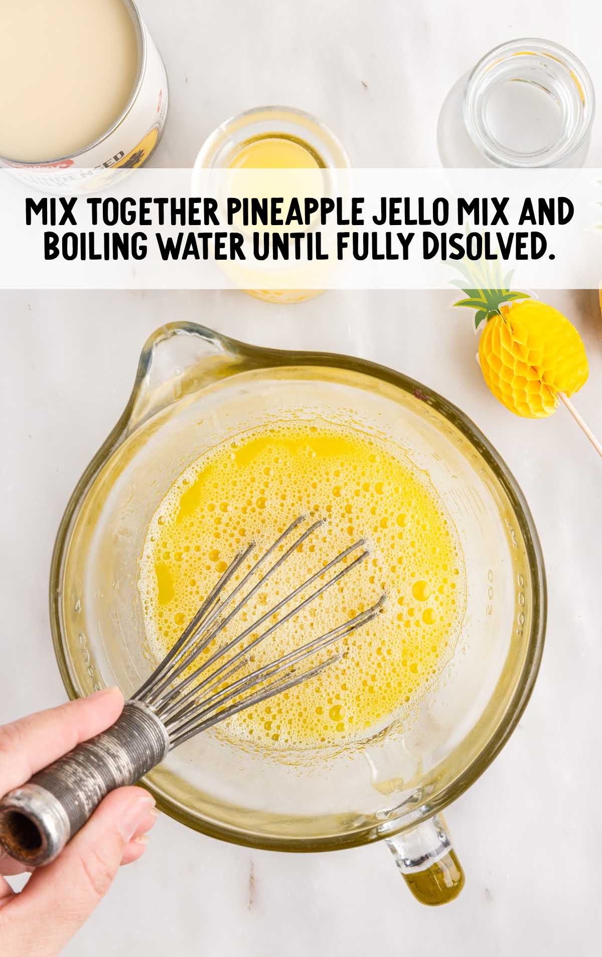 pineapple jello mix and boiling water whisked in a measuring cup