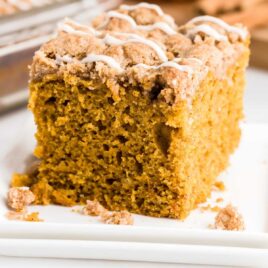 a close up shot of a slice of Pumpkin Coffee Cake on a plate