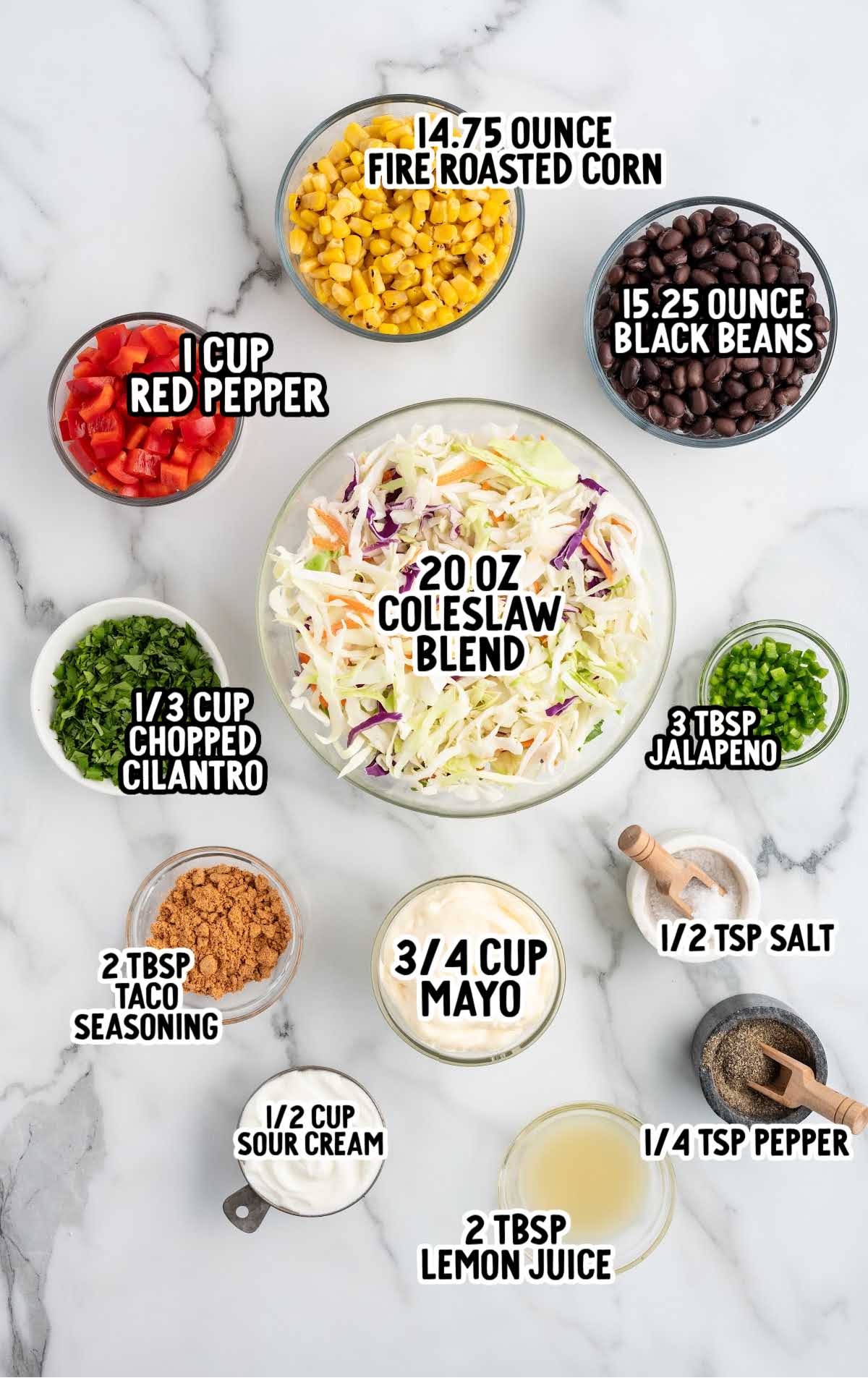 Labeled ingredients for Mexican coleslaw including coleslaw mix, fire roasted corn, black beans, sour cream, and taco seasoning.