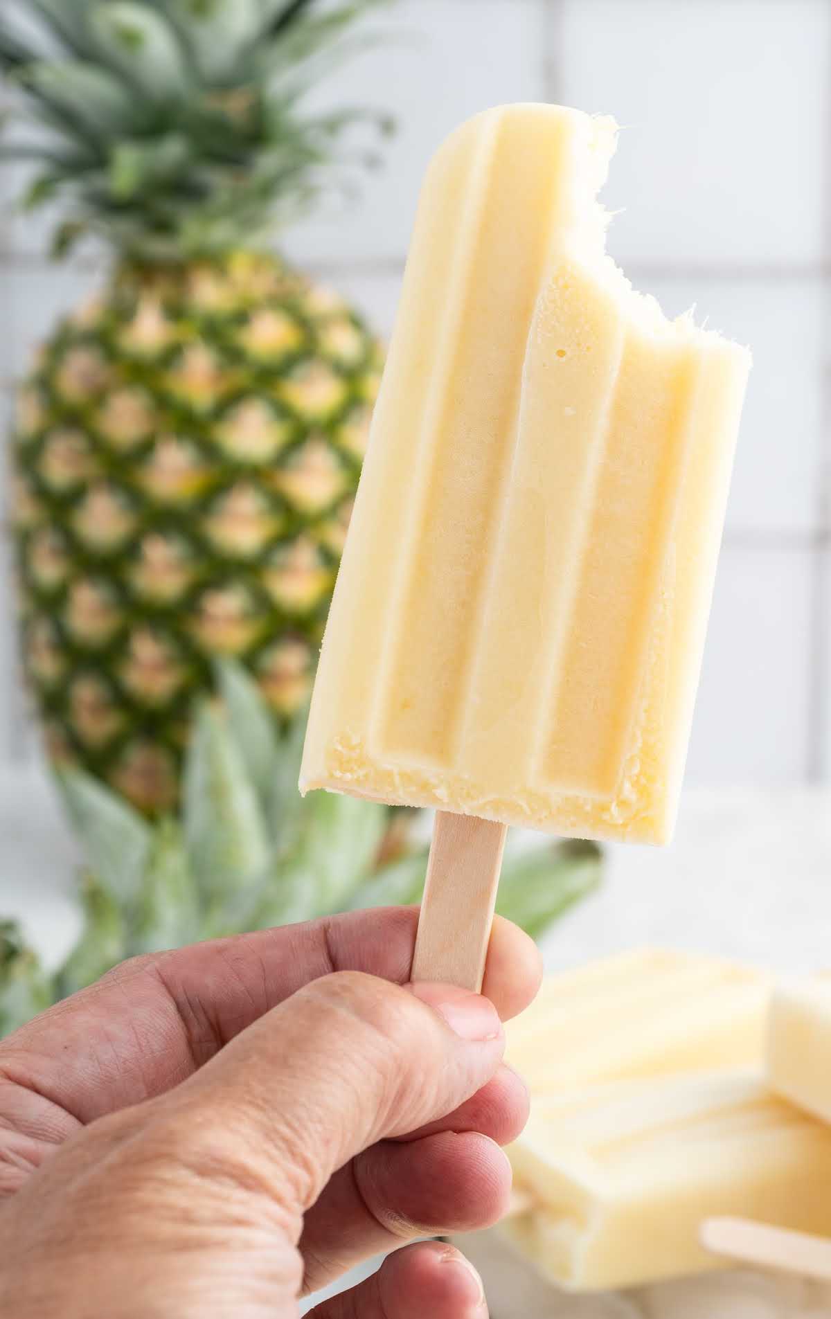 close up shot of a Dole Popsicle with a bite taken out