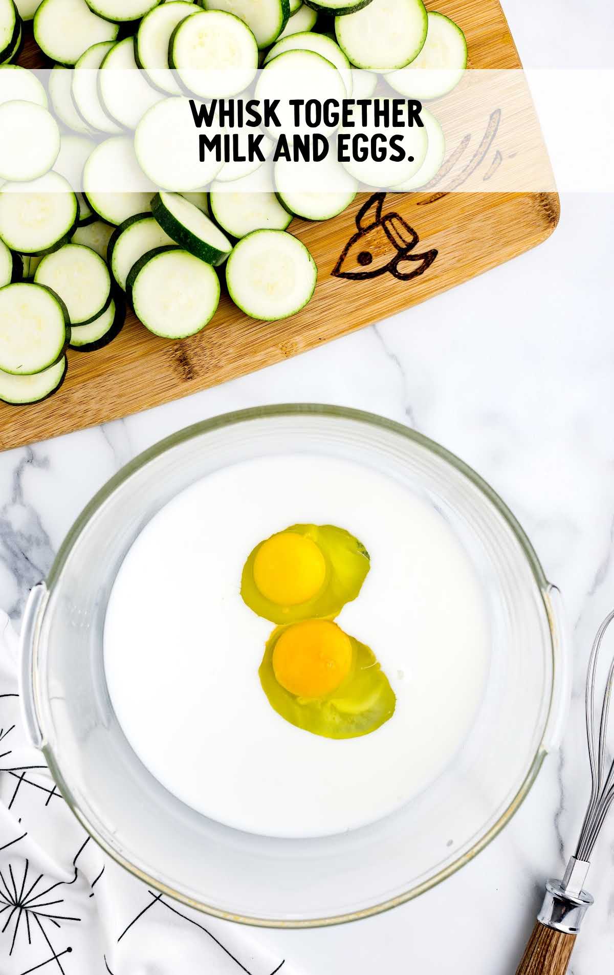 milk and eggs whisked in a bowl