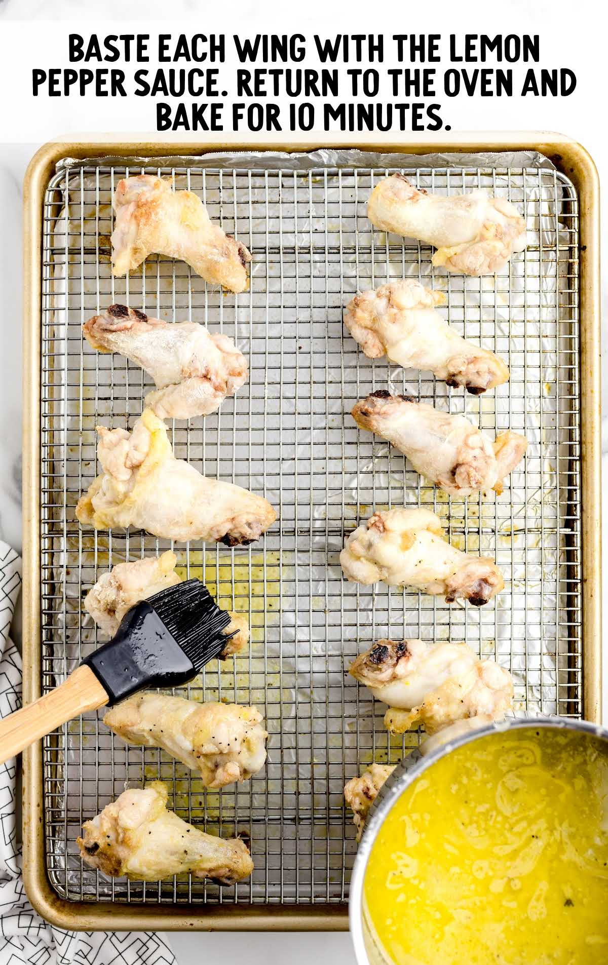Lemon Pepper Wings basted on a cooling rack and baked for 10 minutes