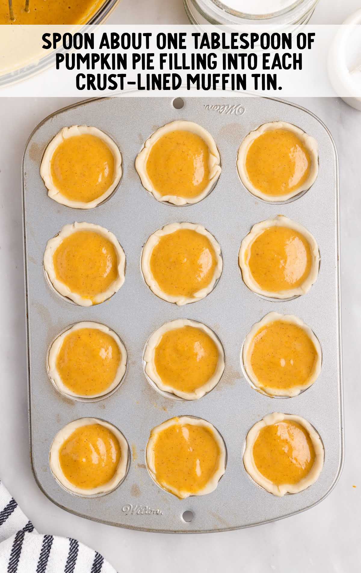 pumpkin pie filling placed into each crust lined muffin tin