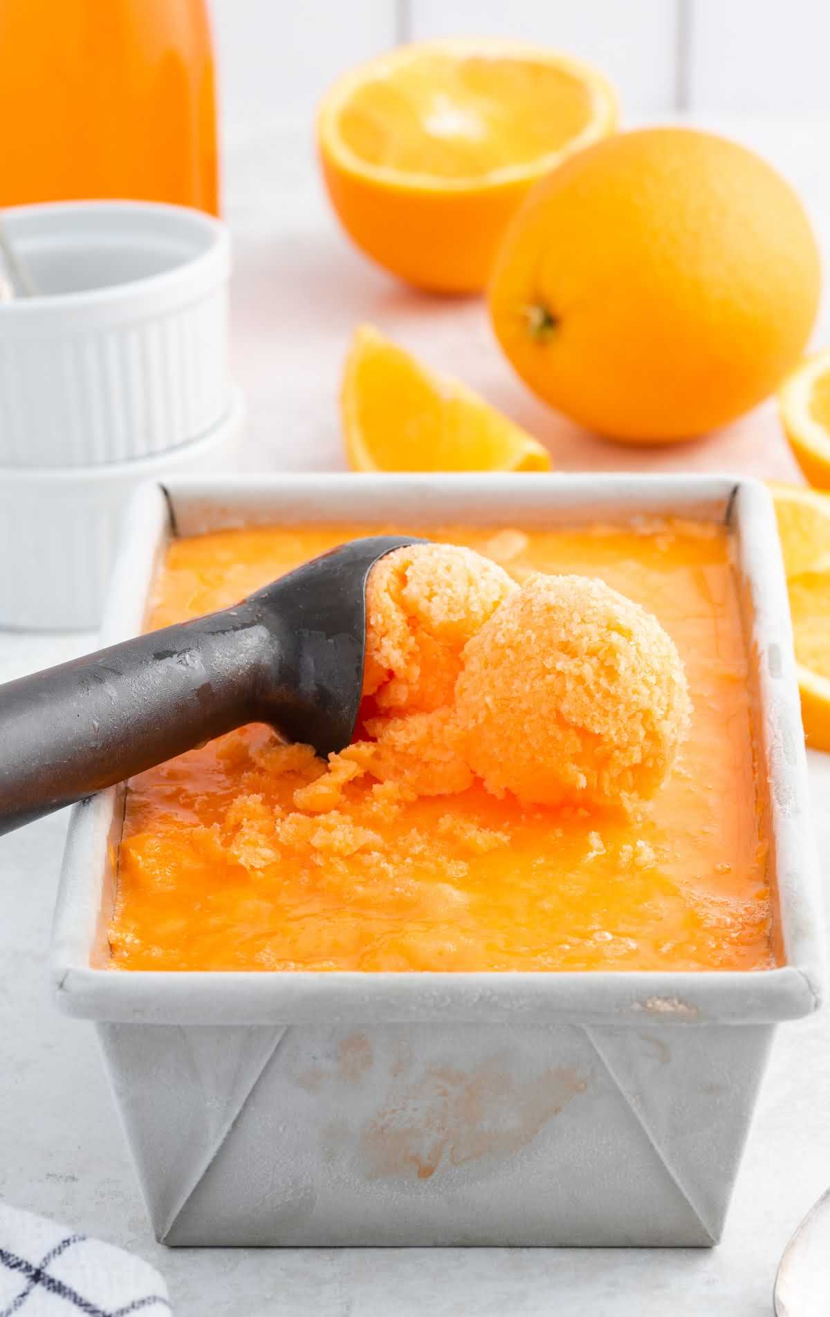 close up shot of Orange Sherbet in a loaf pan