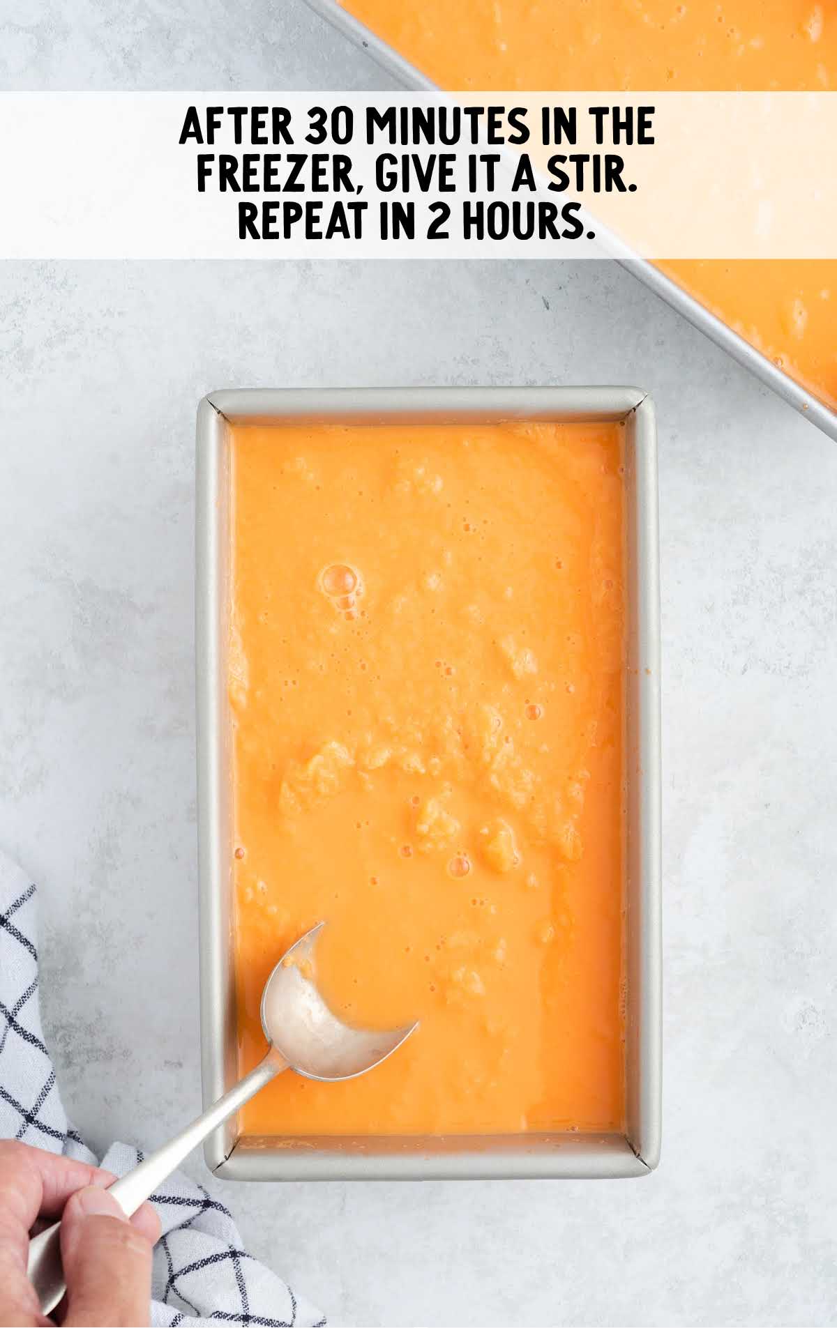 Orange Sherbet mixture in a loaf pan