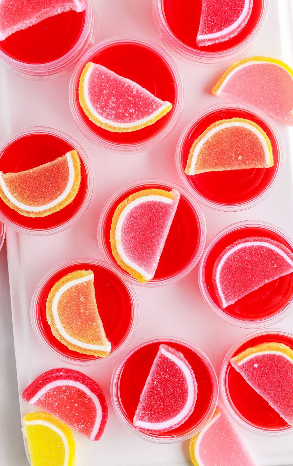 overhead shot of Strawberry Lemonade Jello Shots topped with fruit gummies