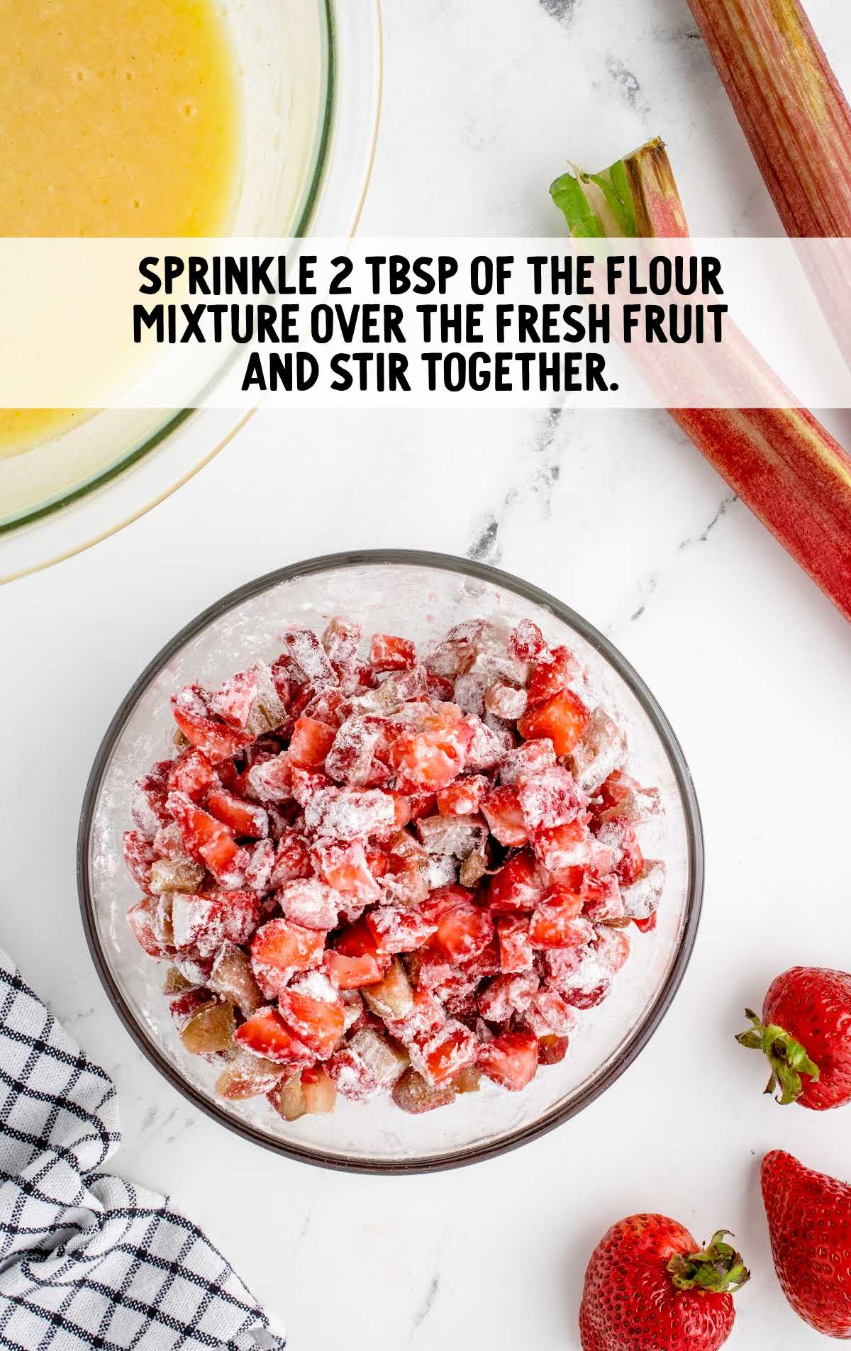 flour sprinkled over the fresh fruit and stirred in a bowl