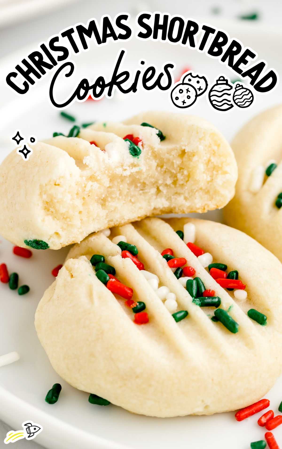 close up shot of Christmas Shortbread Cookies with one having a bite taken out of it