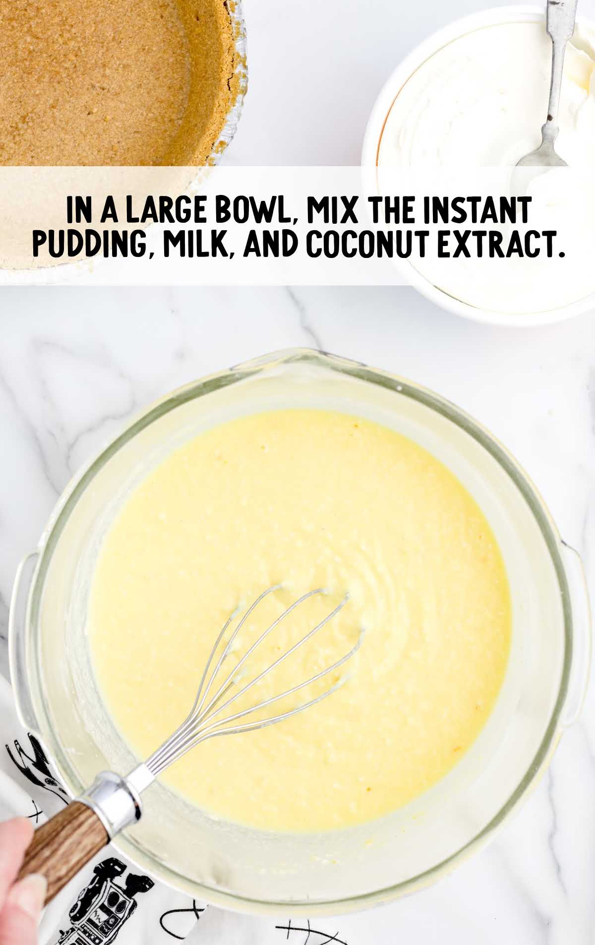 pudding, milk, and coconut extract whisked in a bowl