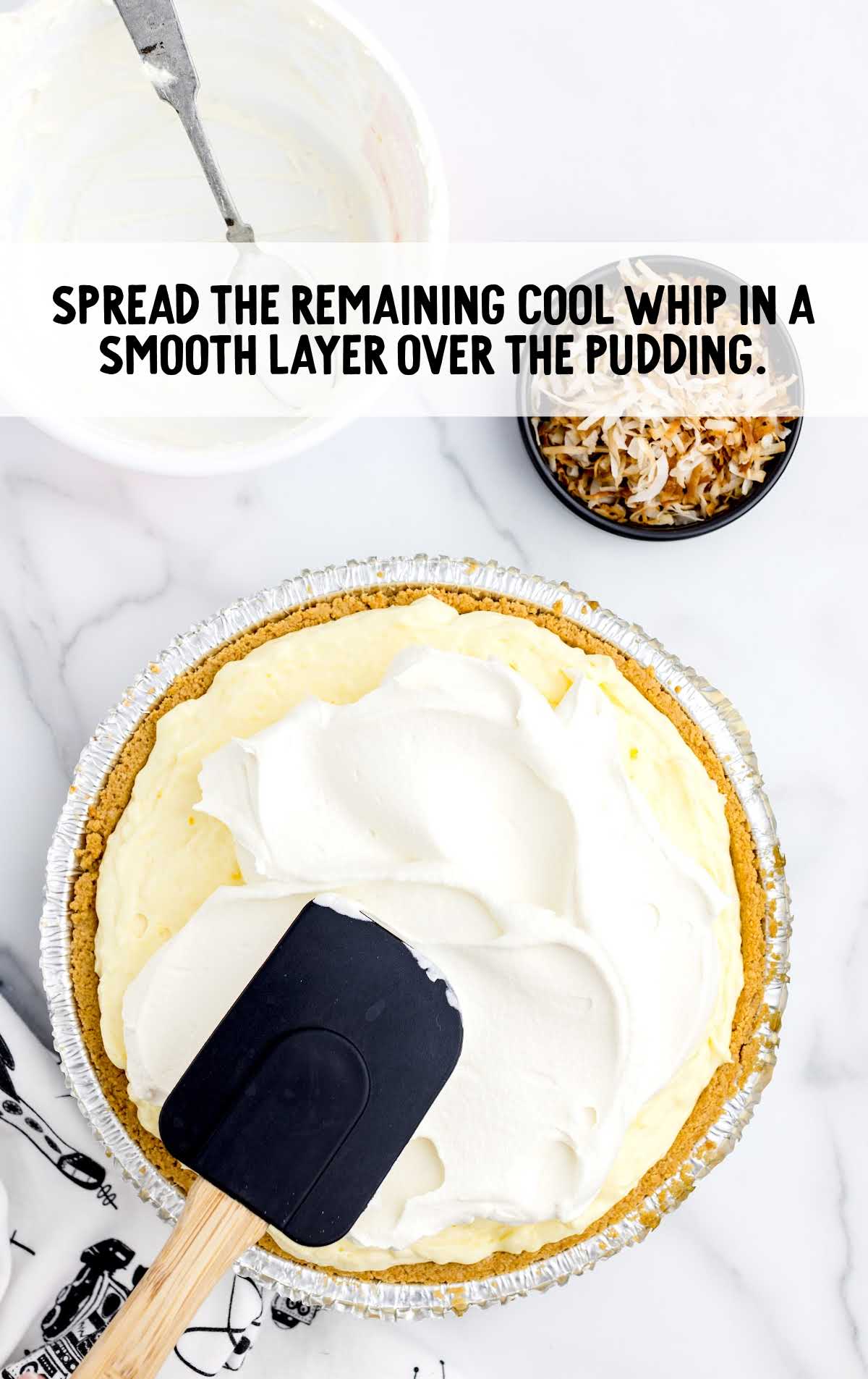 cool whipped spread over the pudding in a dish