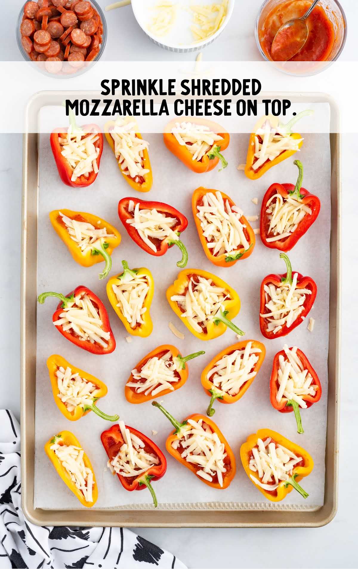 shredded mozzarella cheese sprinkled on top of the pepper pizza bites