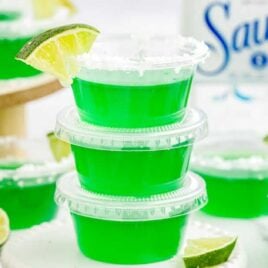 a close up shot of Tequila Jello Shots stacked on top of each other on a stand