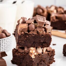 close up shot of Candy Bar Brownies stacked on top of each other
