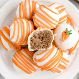 overhead shot of Carrot Cake Cheesecake Bites with one having a bite taken out off